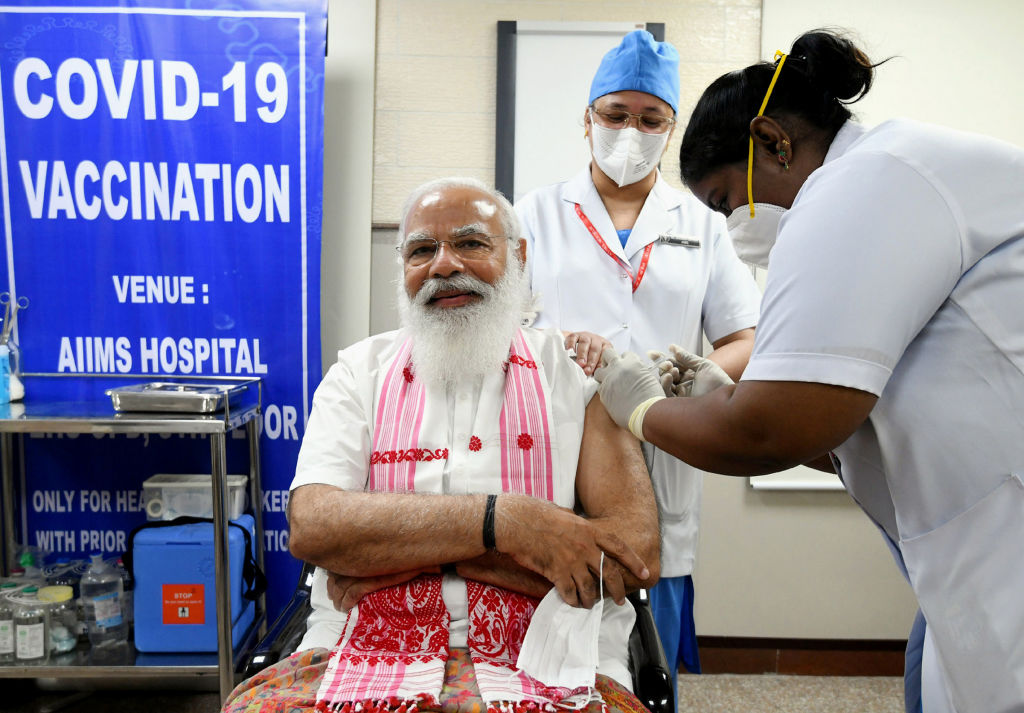 Indian Prime Minister Narendra Modi receives his first dose of a COVID-19 vaccine as the country kicked off the second phase of a vaccination drive, at AIIMS, in New Delhi on March 1, 2021.