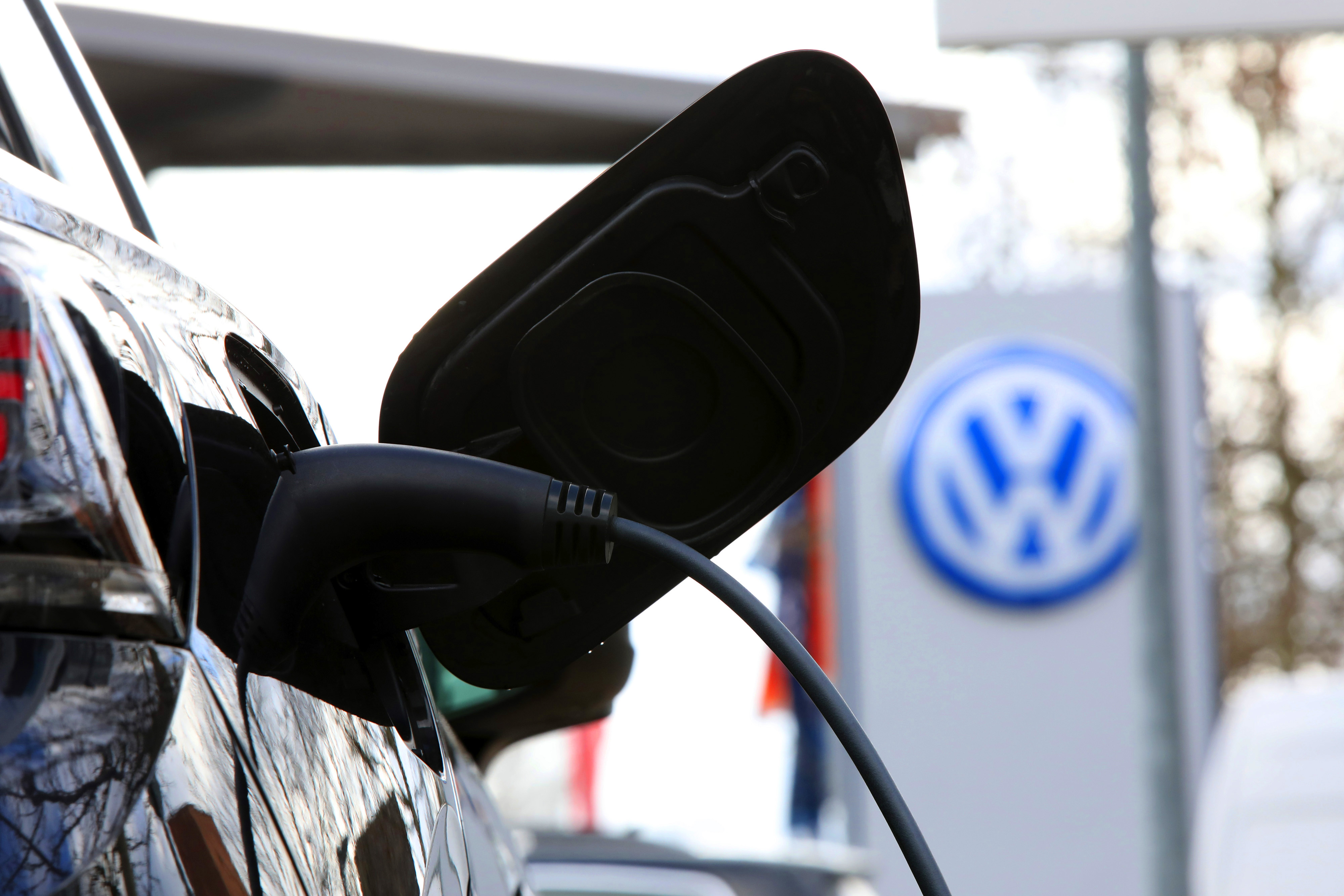 A Volkswagen ID.4 electric SUV refuels on the forecourt of a Volkswagen AG (VW) showroom in Berlin, Germany.