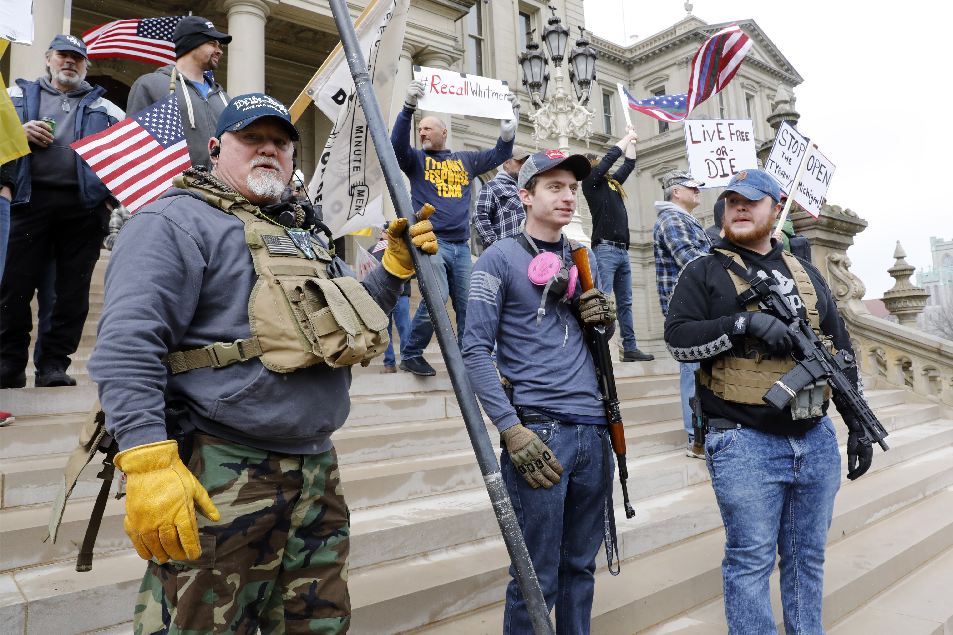 Armed protestors rally against COVID-19 pandemic control measures in Michigan on April 15. The state is currently far and away the hardest-hit state in the U.S. right now.