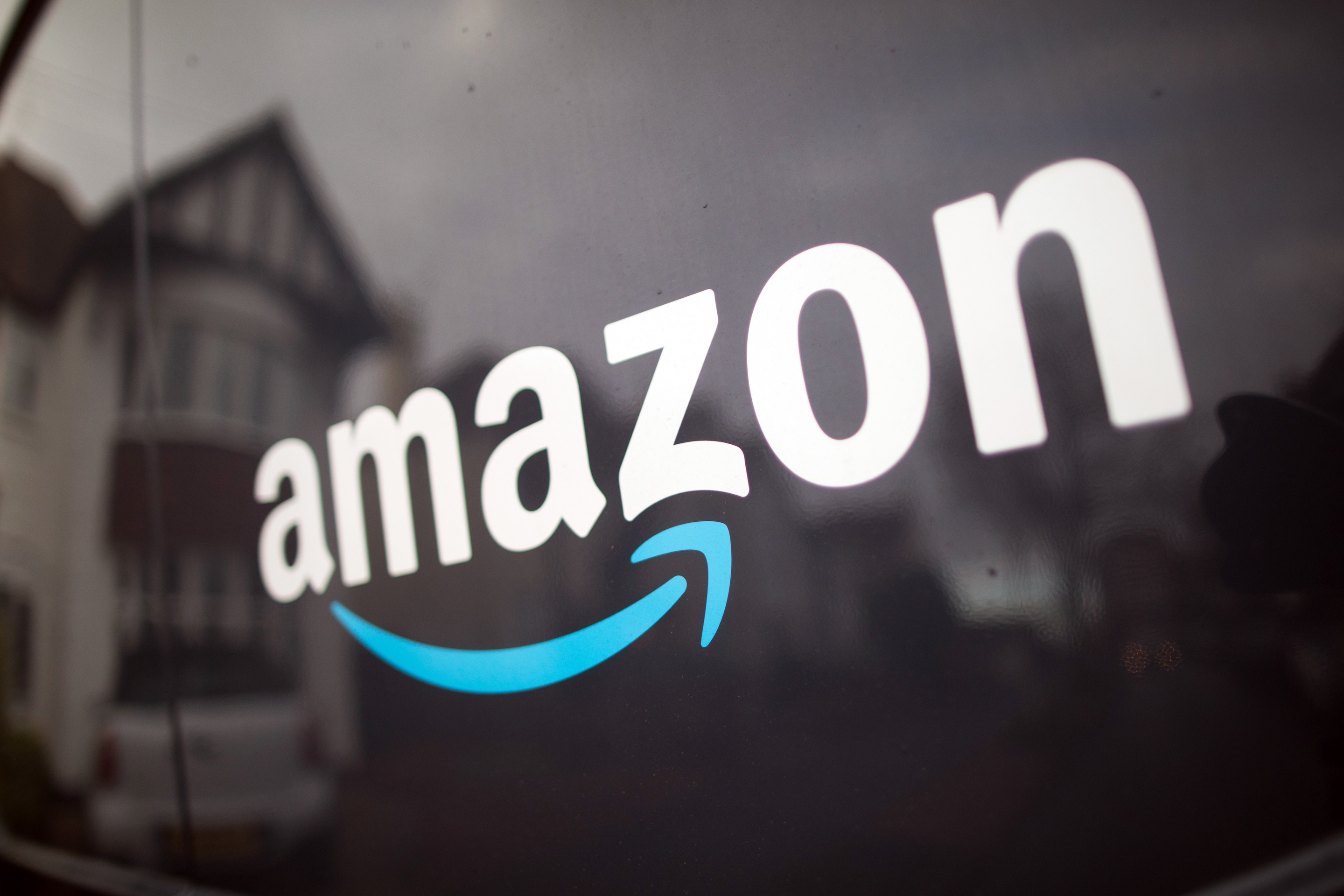 The Amazon.com Inc. company logo on the side of a delivery van in Leigh-on-Sea, U.K., on Thursday, Nov. 26, 2020.