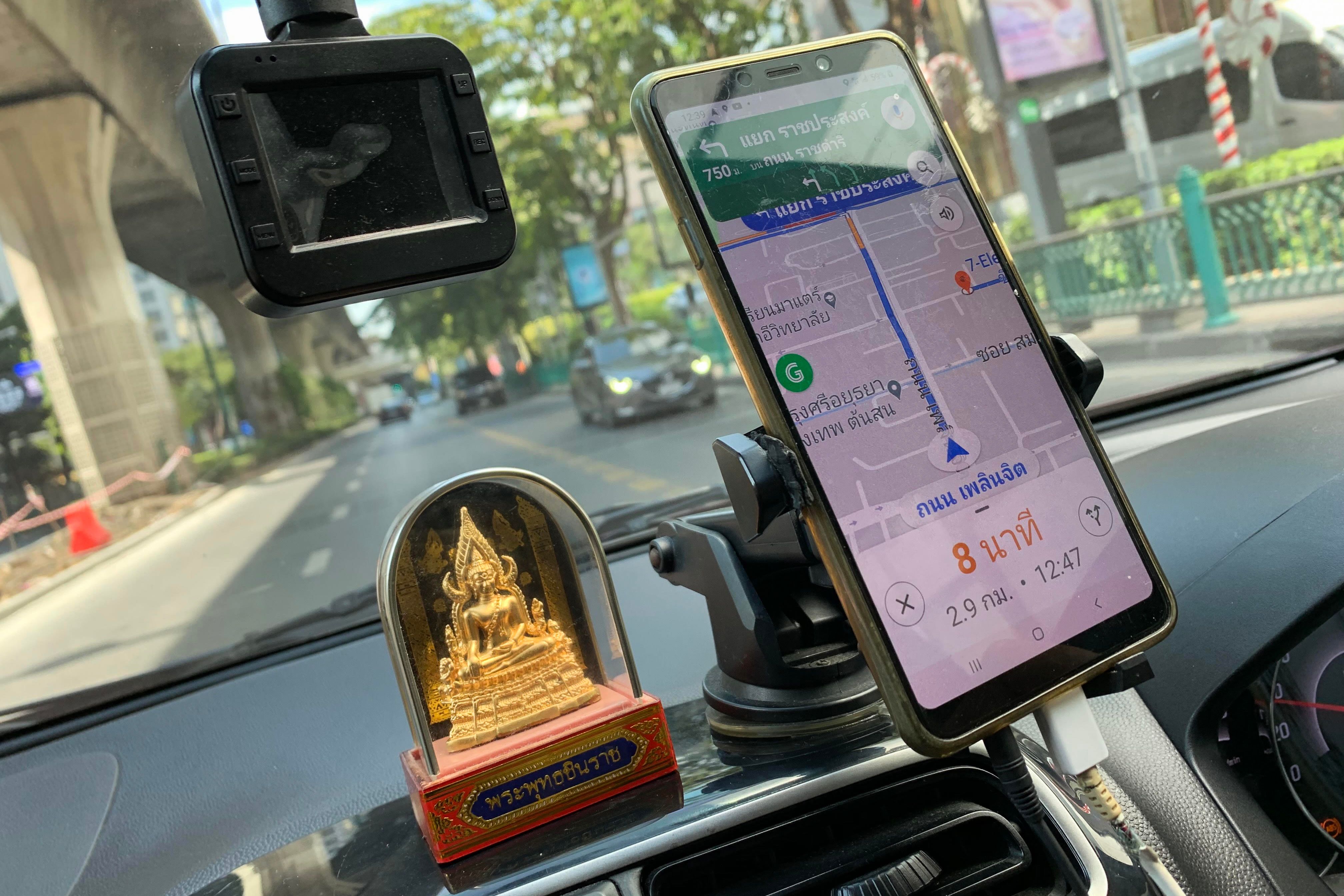 A Grab car equipped with road navigation app in Bangkok.