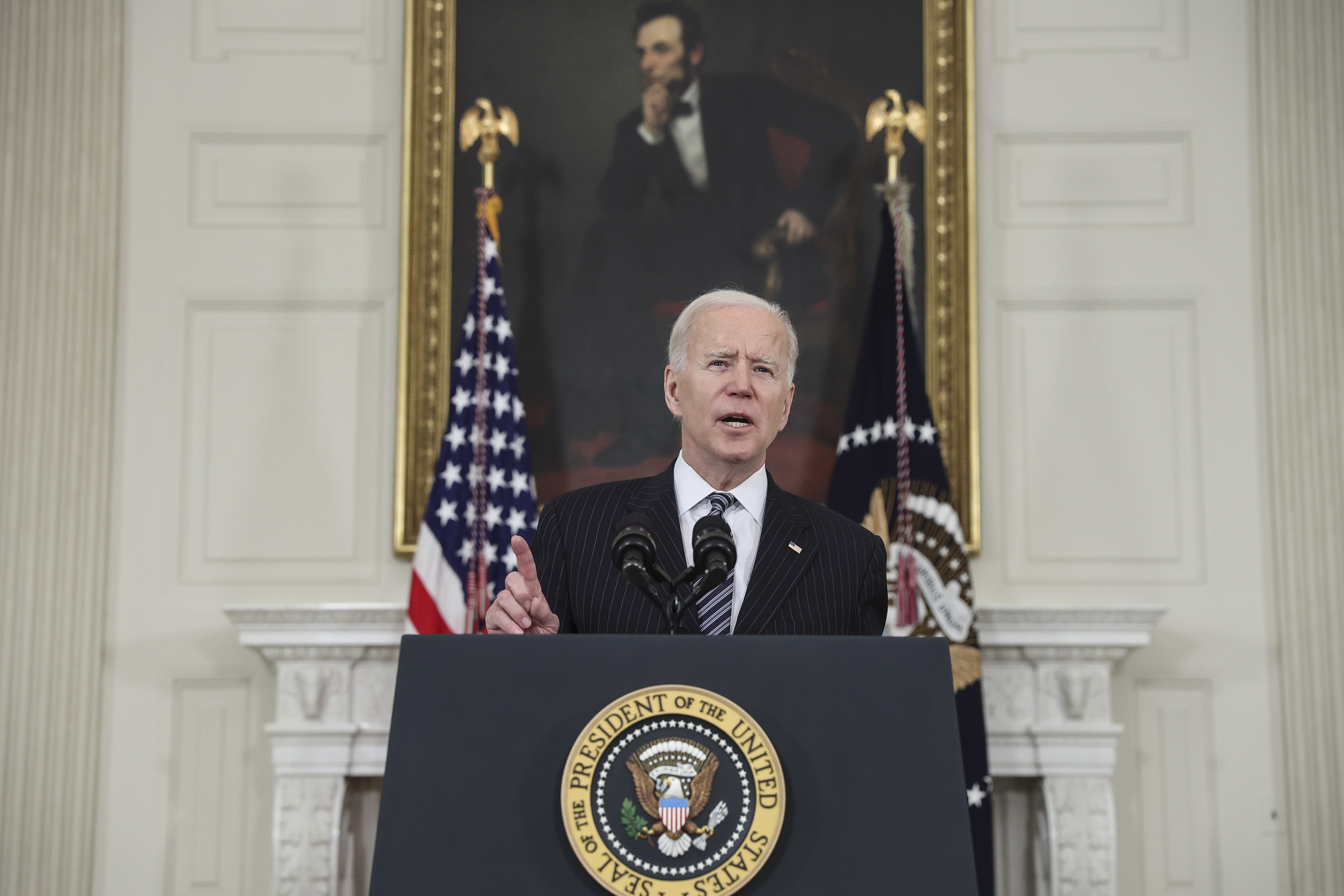 U.S. President Joe Biden speaks in the State Dining Room of the White House in Washington, D.C., U.S., on Tuesday, April 6, 2021. Biden announced that he wants all American adults to be eligible for a coronavirus vaccine by April 19.