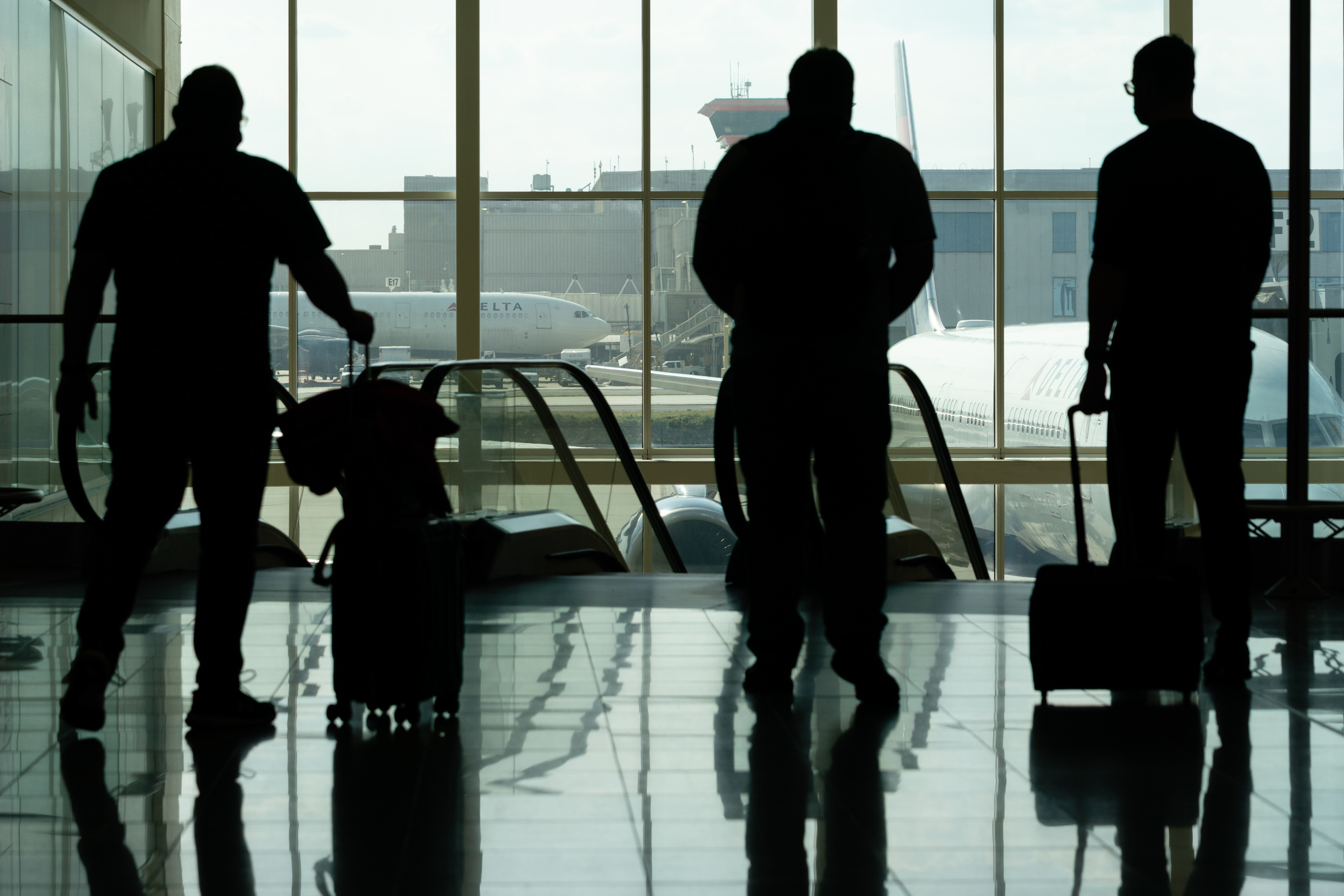 Passengers walk through the international concourse at Hartsfield-Jackson Atlanta International Airport in Atlanta, Georgia, U.S., on Wednesday, April 7, 2021.