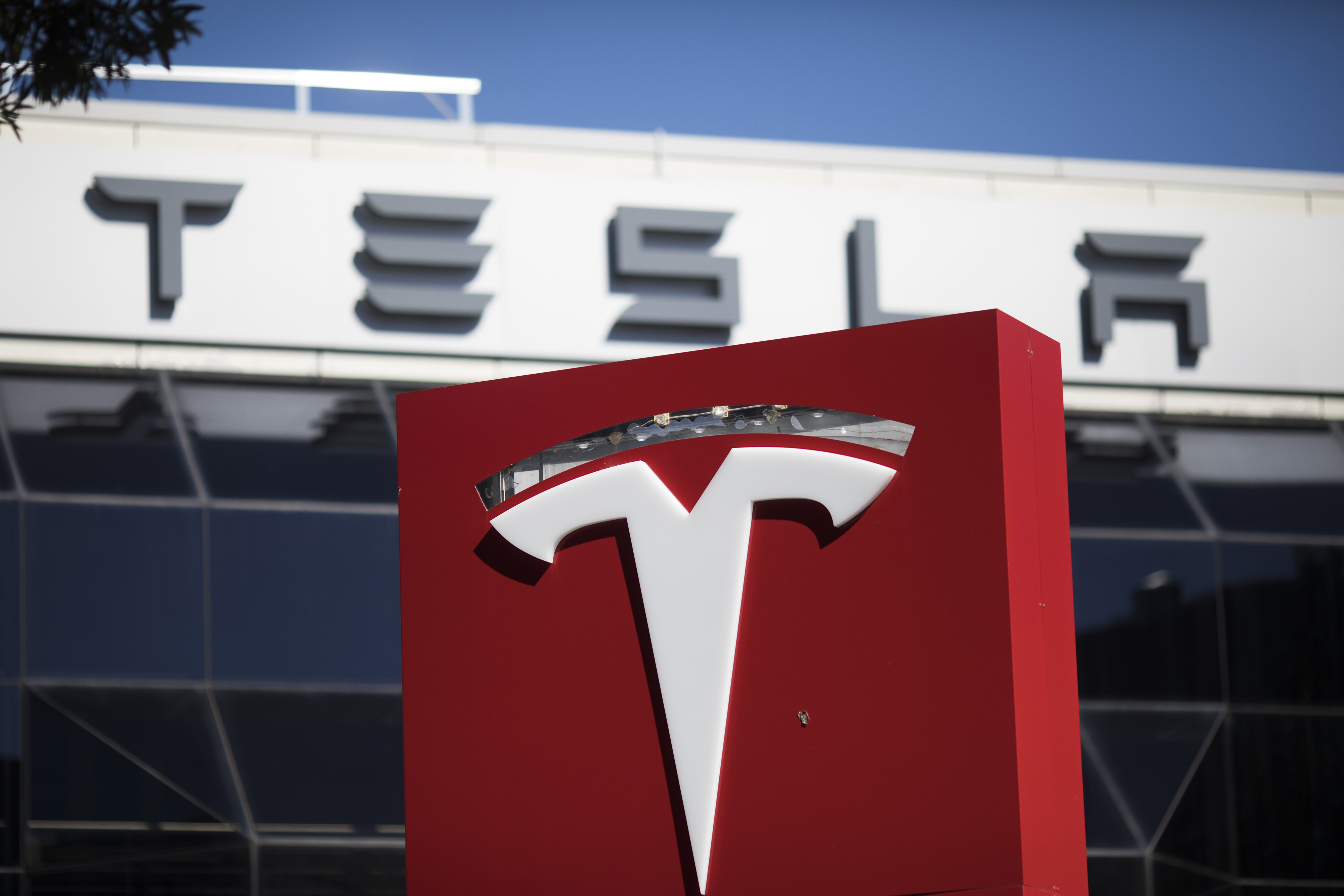 Signage outside a Tesla Inc. service center in Sydney, Australia, on April 12, 2021.