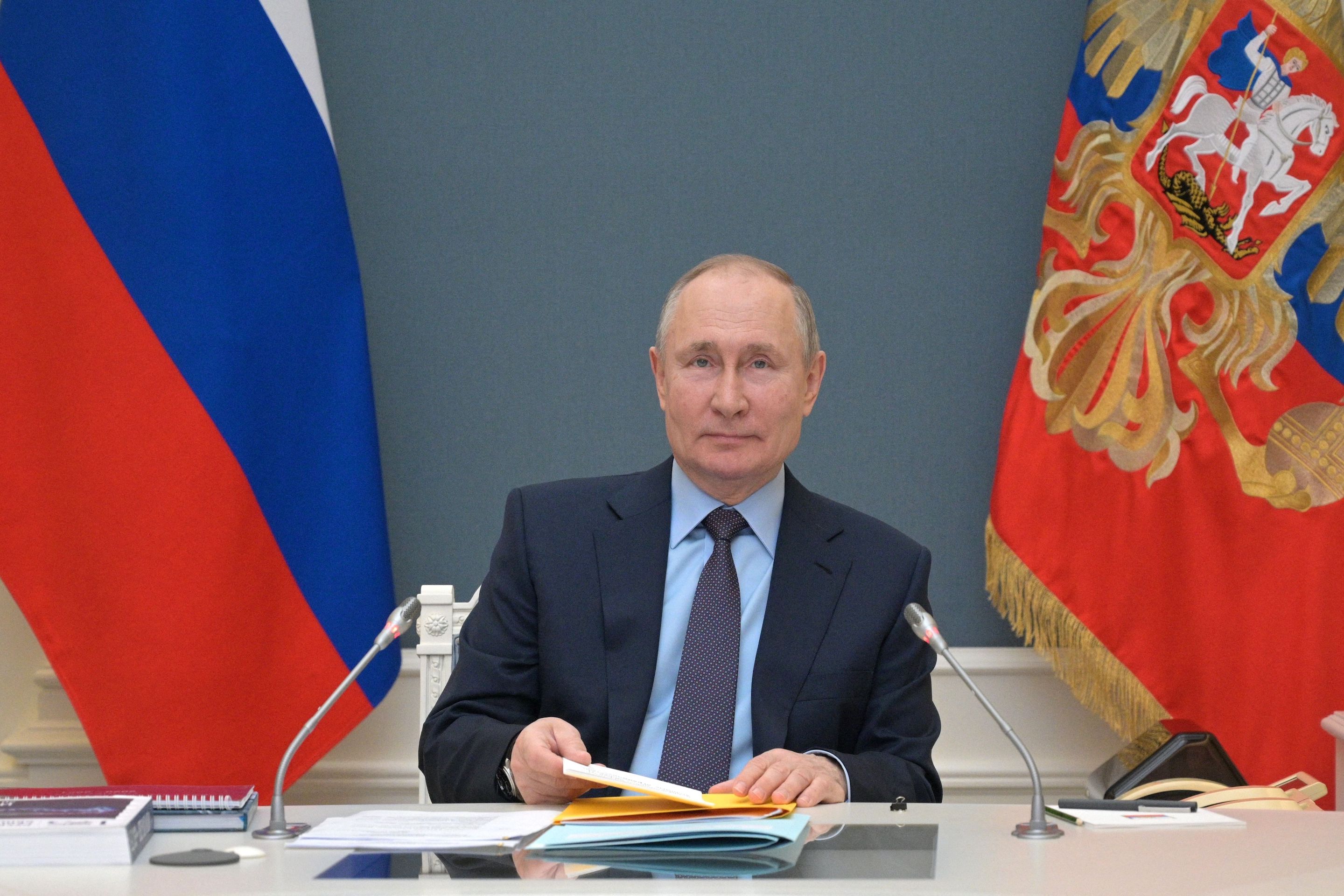 Vladimir Putin attends the Russian Geographical Society's Trustee Council meeting via a video link in Moscow on April 14, 2021.