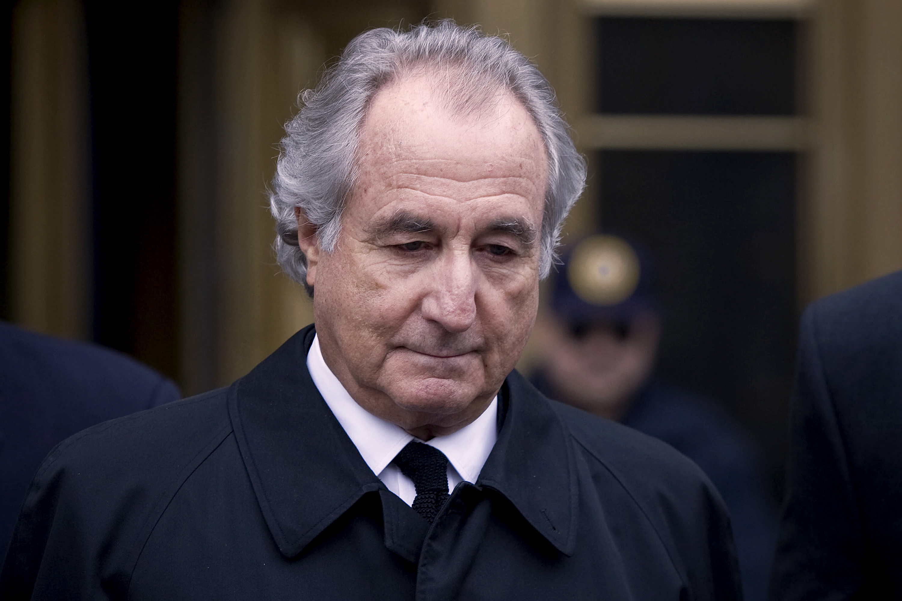 Bernard Madoff, founder of Bernard L. Madoff Investment Securities LLC, leaves federal court in New York, U.S., on Tuesday, March 10, 2009. Madoff, the Manhattan investment adviser who promised stellar returns to his A-list clients and instead defrauded them of more than $19 billion in historys largest Ponzi scheme, has died. He was 82.