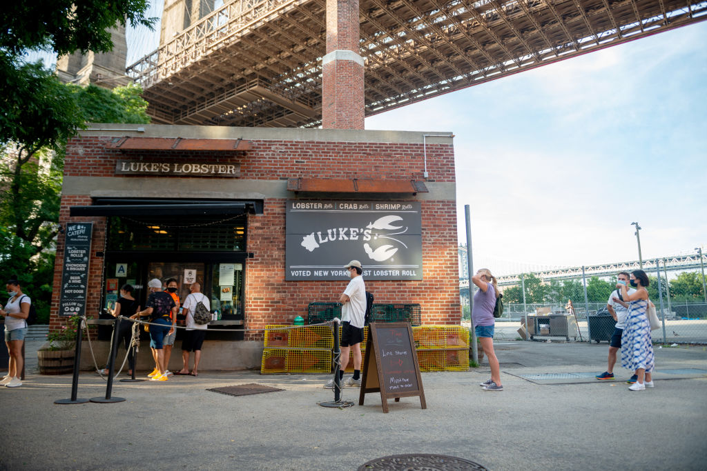 Customers line up (and practice social distancing) outside a Luke’s Lobster in Brooklyn.