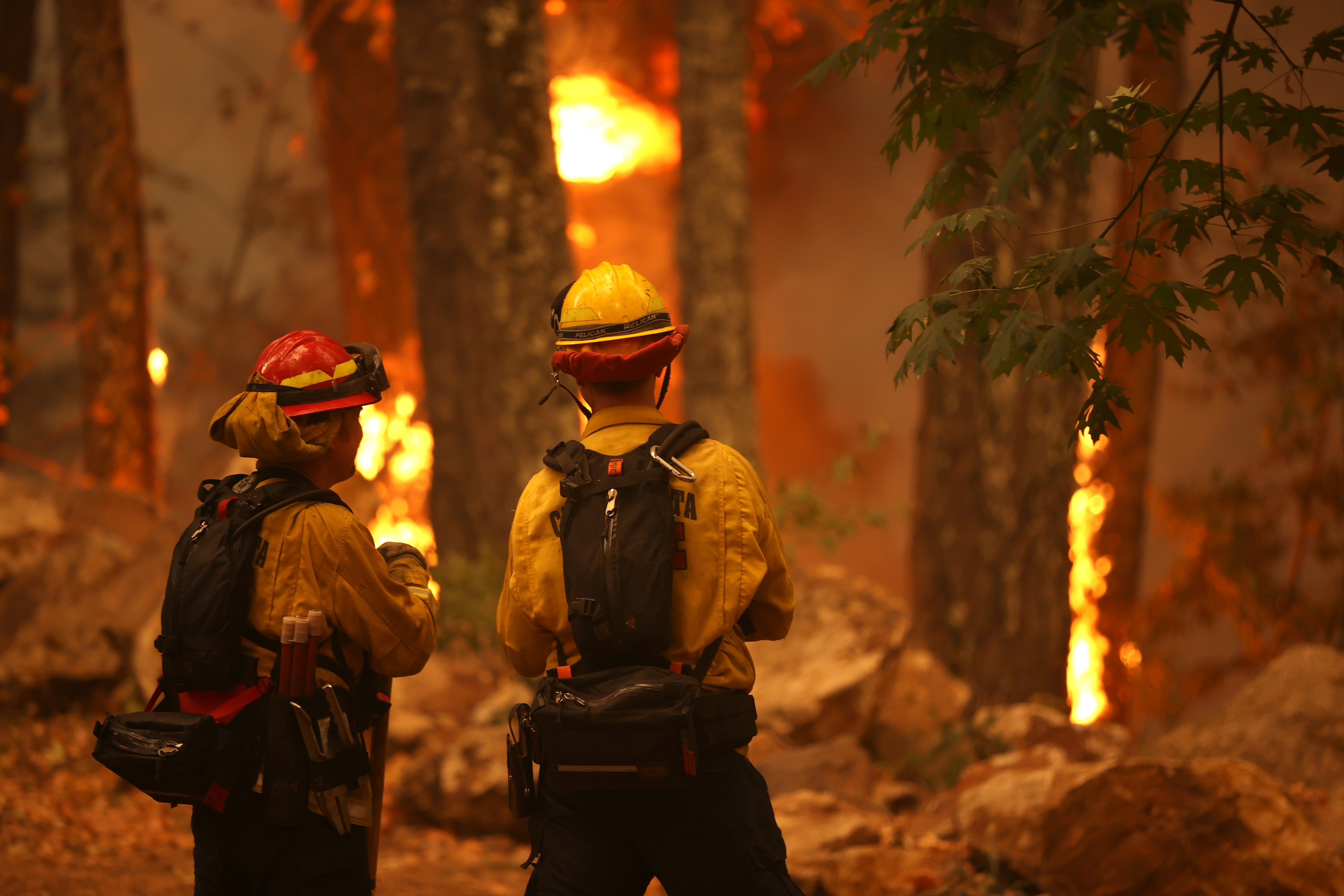 Firefighters monitor the Glass Fire on Oct. 1, 2020 in Calistoga, Calif.