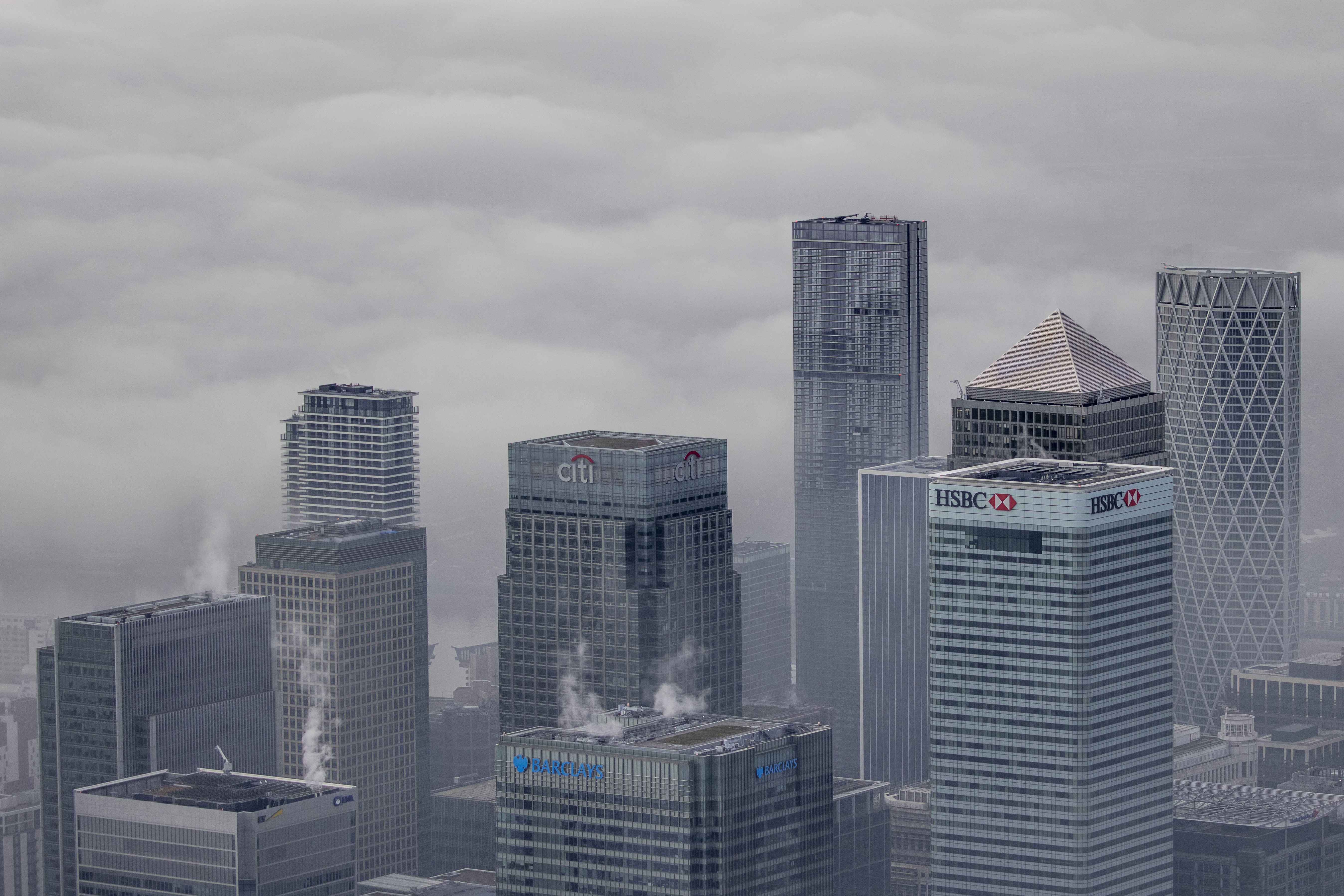 Fog shrouds the Canary Wharf business district including global financial institutions Citigroup Inc., State Street Corp., Barclays Plc, HSBC Holdings Plc and the commercial office block No. 1 Canada Square, on the Isle of Dogs on November 5, 2020 in London, England.