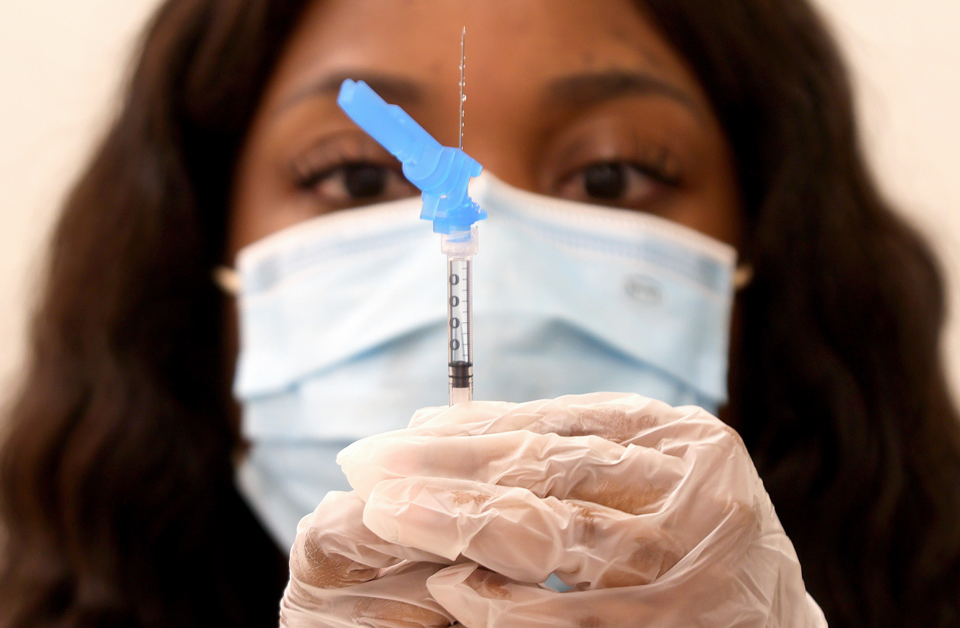 A nurse in California prepares a dose of the Johnson & Johnson COVID-19 vaccine in California in early March. The CDC and FDA have since temporarily suspended the vaccine's use in the U.S.