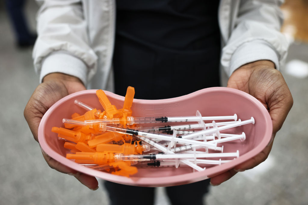 A medical worker with Northwell Health bears doses of the Johnson & Johnson vaccine at a pop-up vaccination site on Staten Island on April 8, 2021, in New York City.