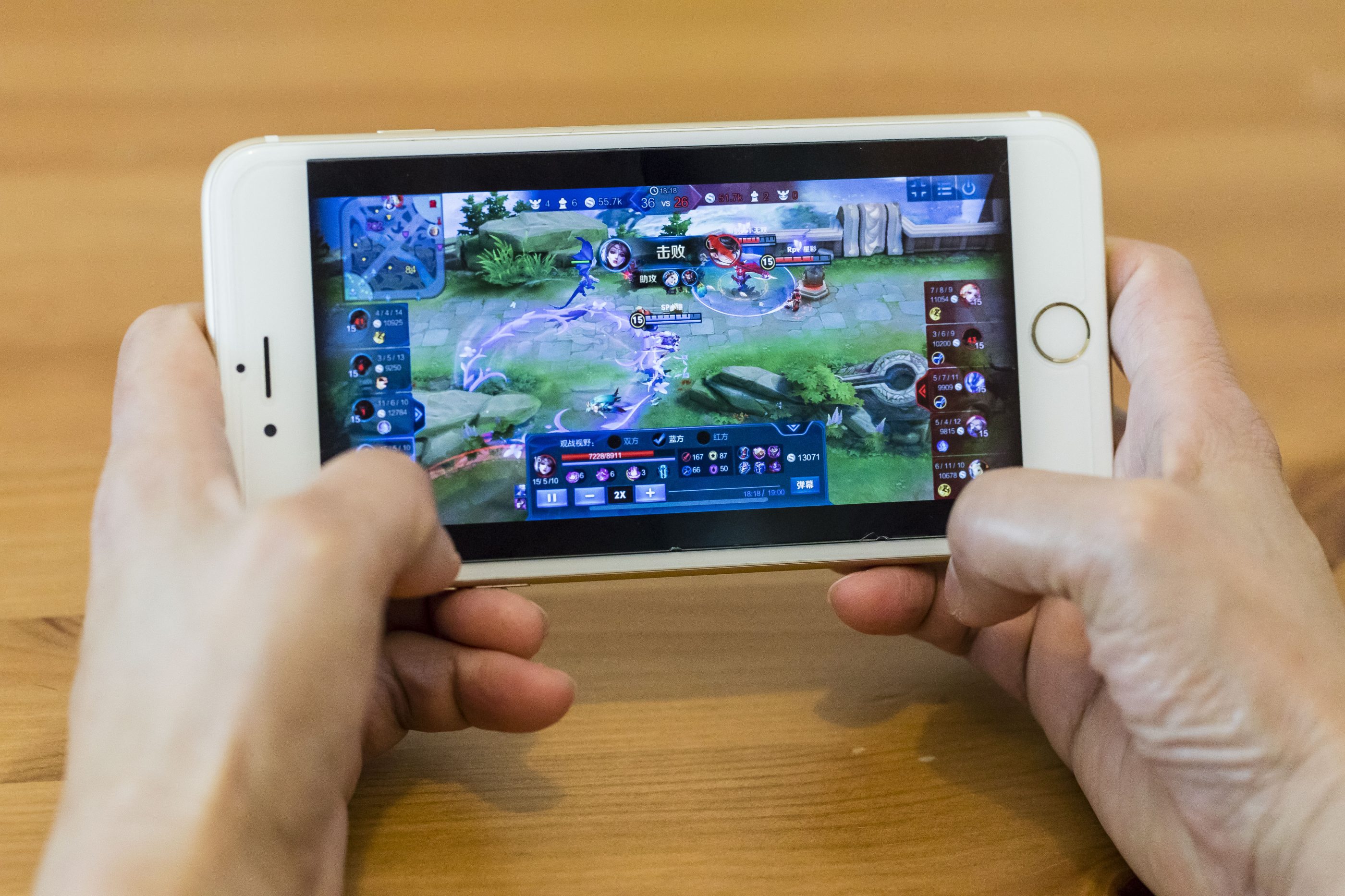 A teenager plays 'Wangzhe Rongyao,' known as 'King of Glory,' developed and published by Tencent Games in Hong Kong on Sept. 11, 2018.