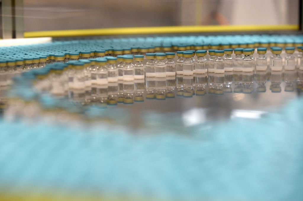 View of vials on a production line at the factory of British multinational pharmaceutical company GlaxoSmithKline.
