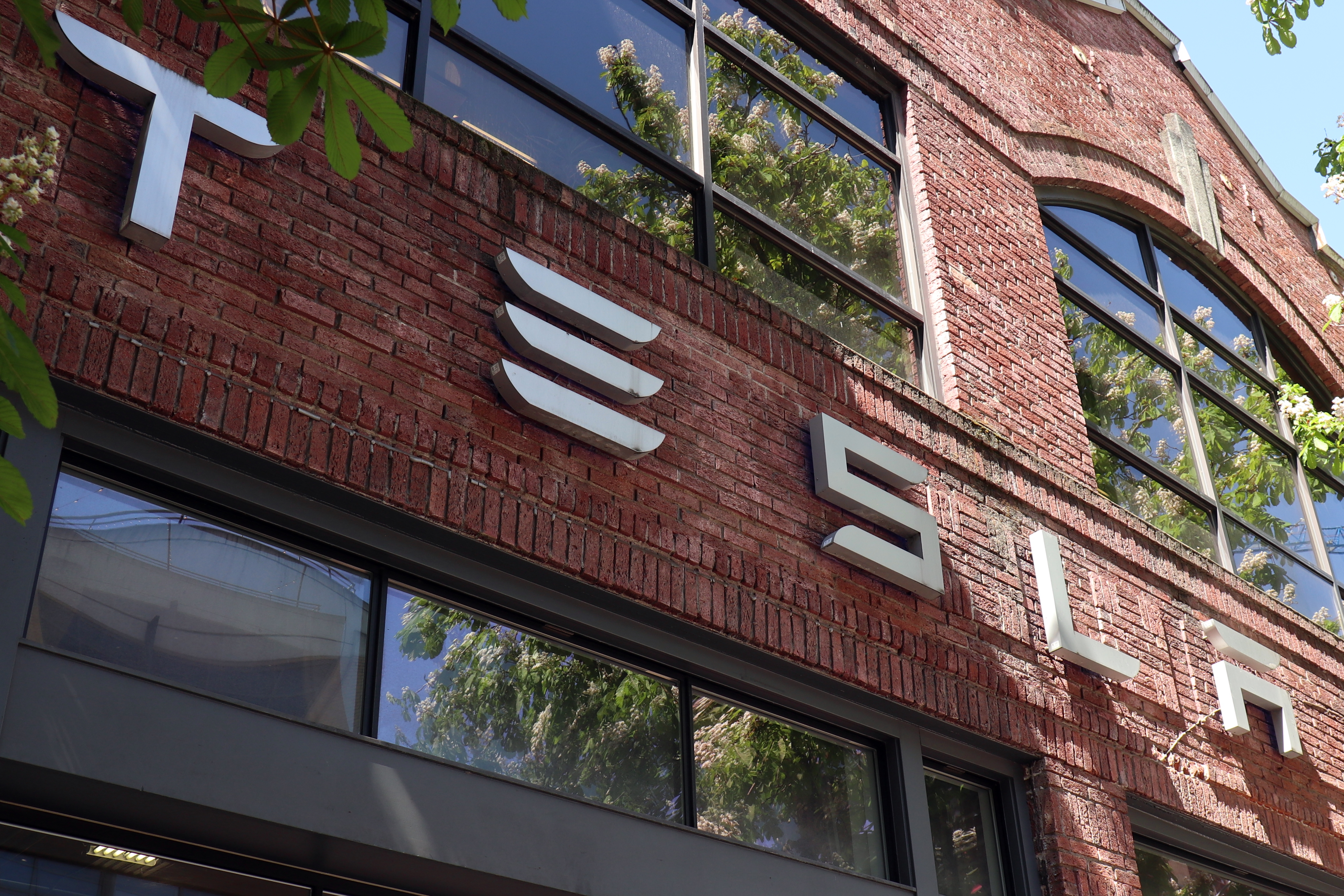 The exterior of a Tesla showroom is seen in Seattle.