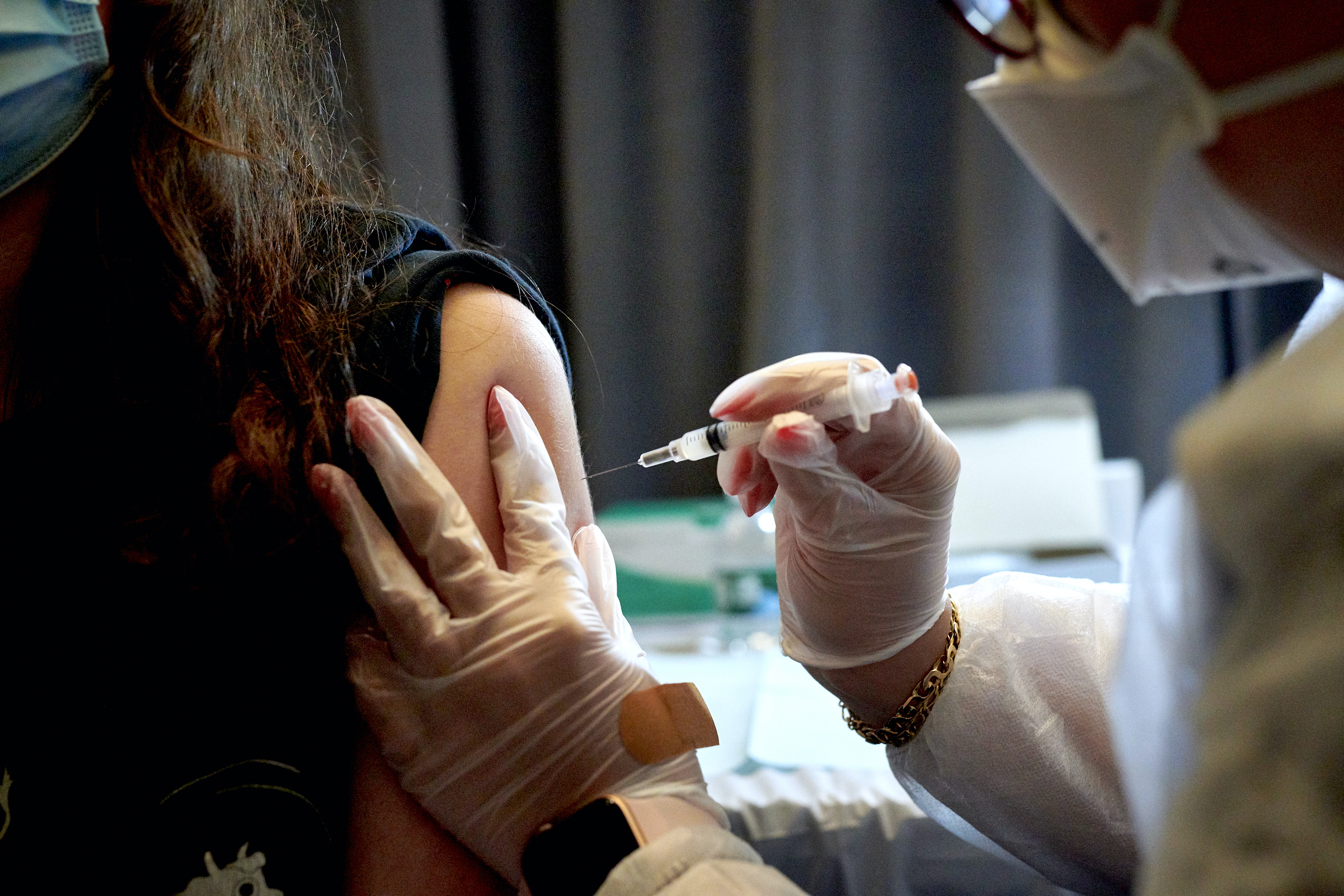 A healthcare worker administers the Moderna COVID-19 vaccine at the American Museum of Natural History vaccination site in New York on April 30, 2021.