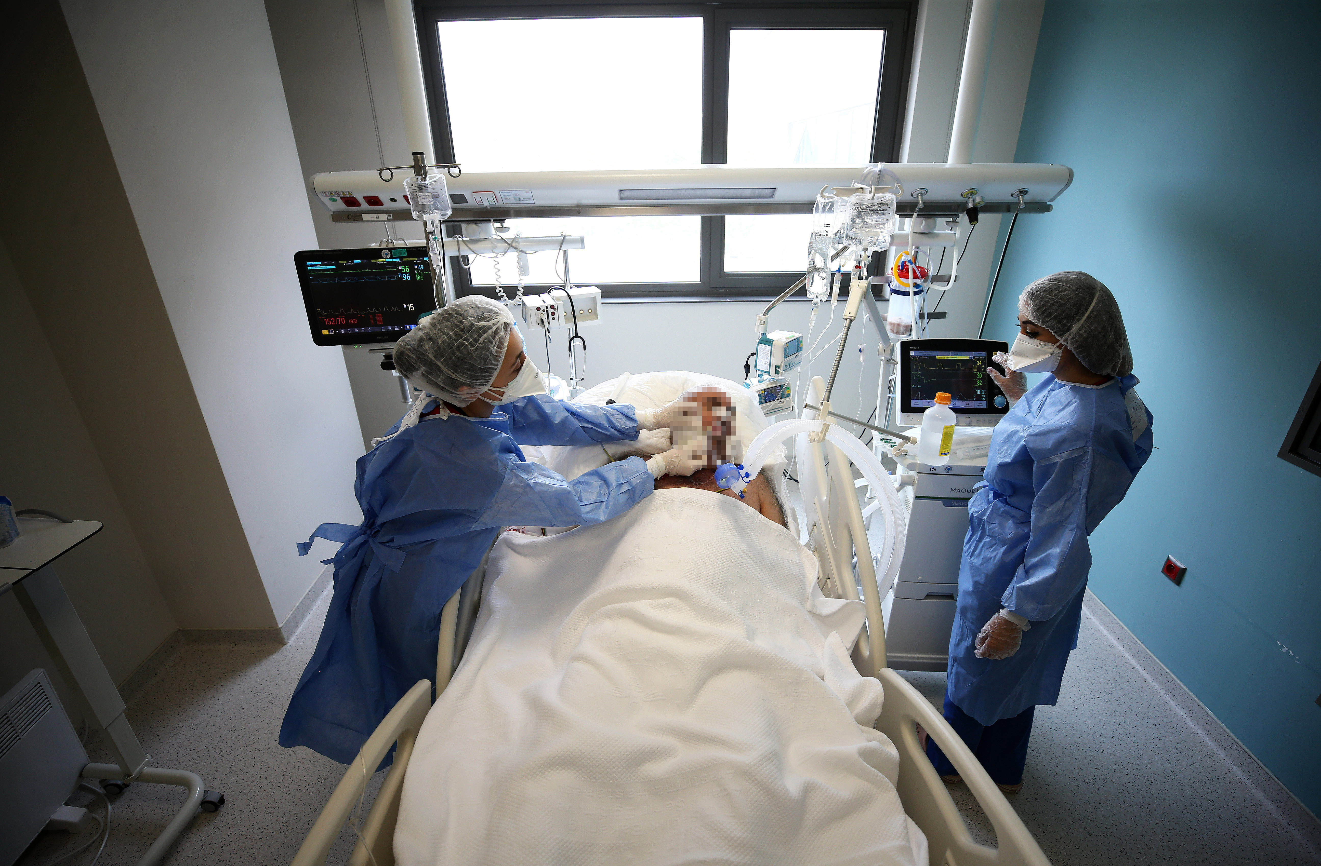 Nurses wearing fully covered suit, make routine care and control of a Covid-19 patient as they continue to fight devotedly against Covid-19 pandemic, at Adana City Training and Research Hospital on May 5, 2021, in Adana, Turkey.