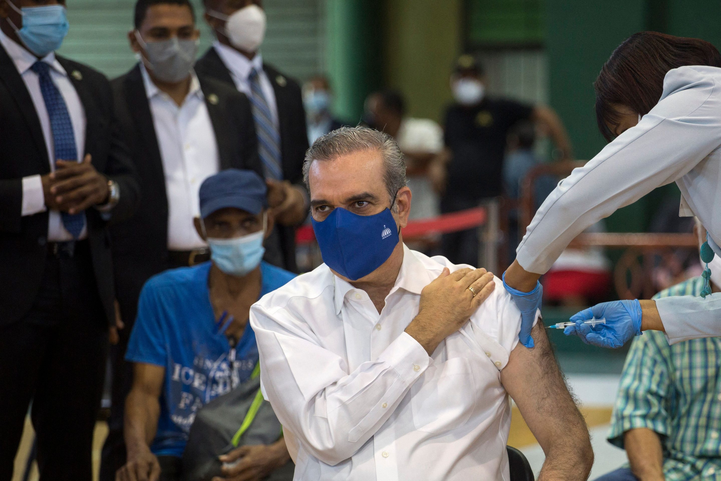 Dominican President Luis Abinader receives the Chinese Sinovac vaccine against COVID-19, two and a half months after the country began to immunize its population against the disease, in Santo Domingo, on May 5, 2021.