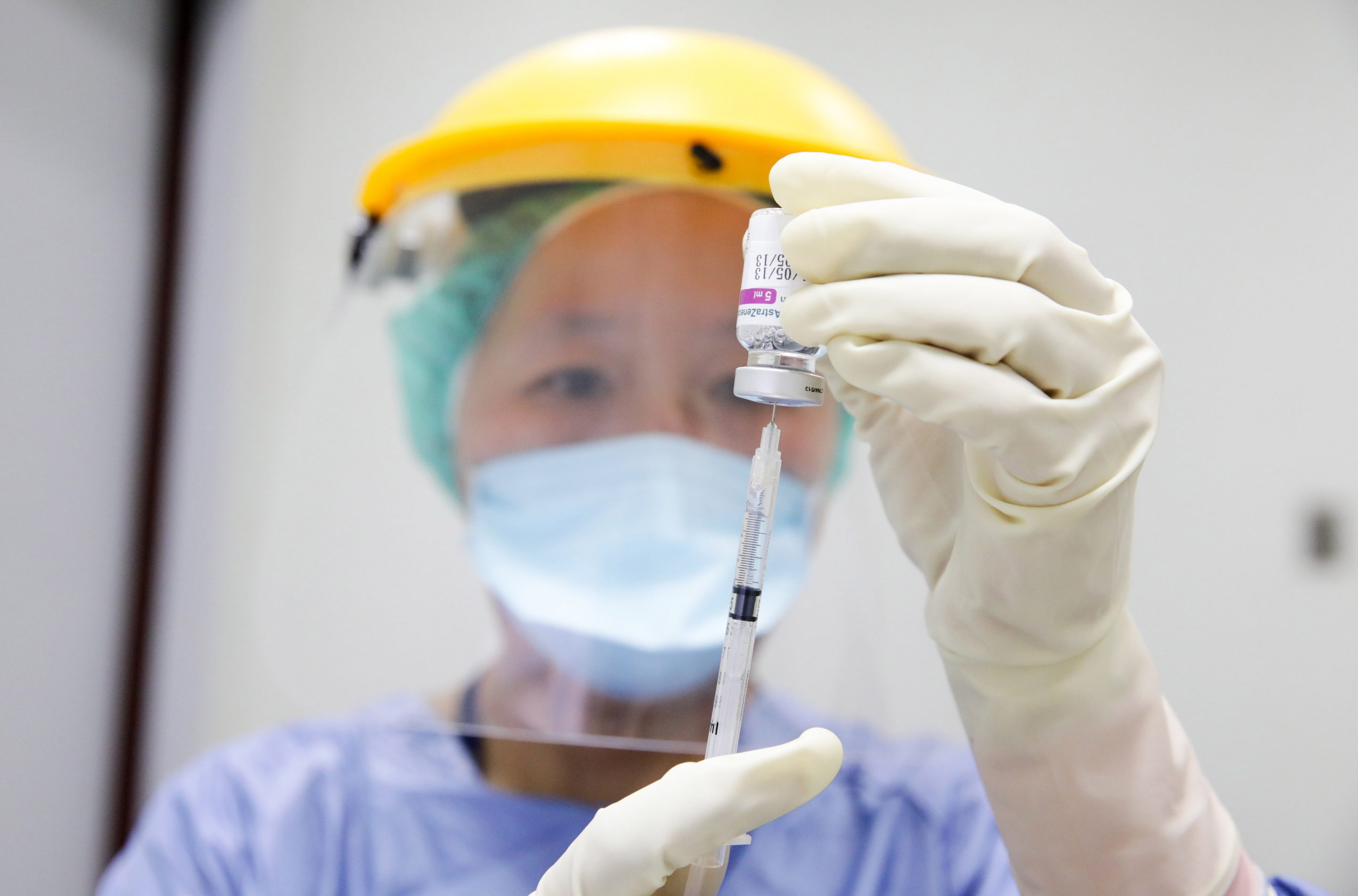 A nurse wearing personal protective equipment (PPE) prepares a dose of the AstraZeneca Plc Covid-19 vaccine at Chang Gung Memorial Hospital in Taipei, Taiwan on May 13, 2021.