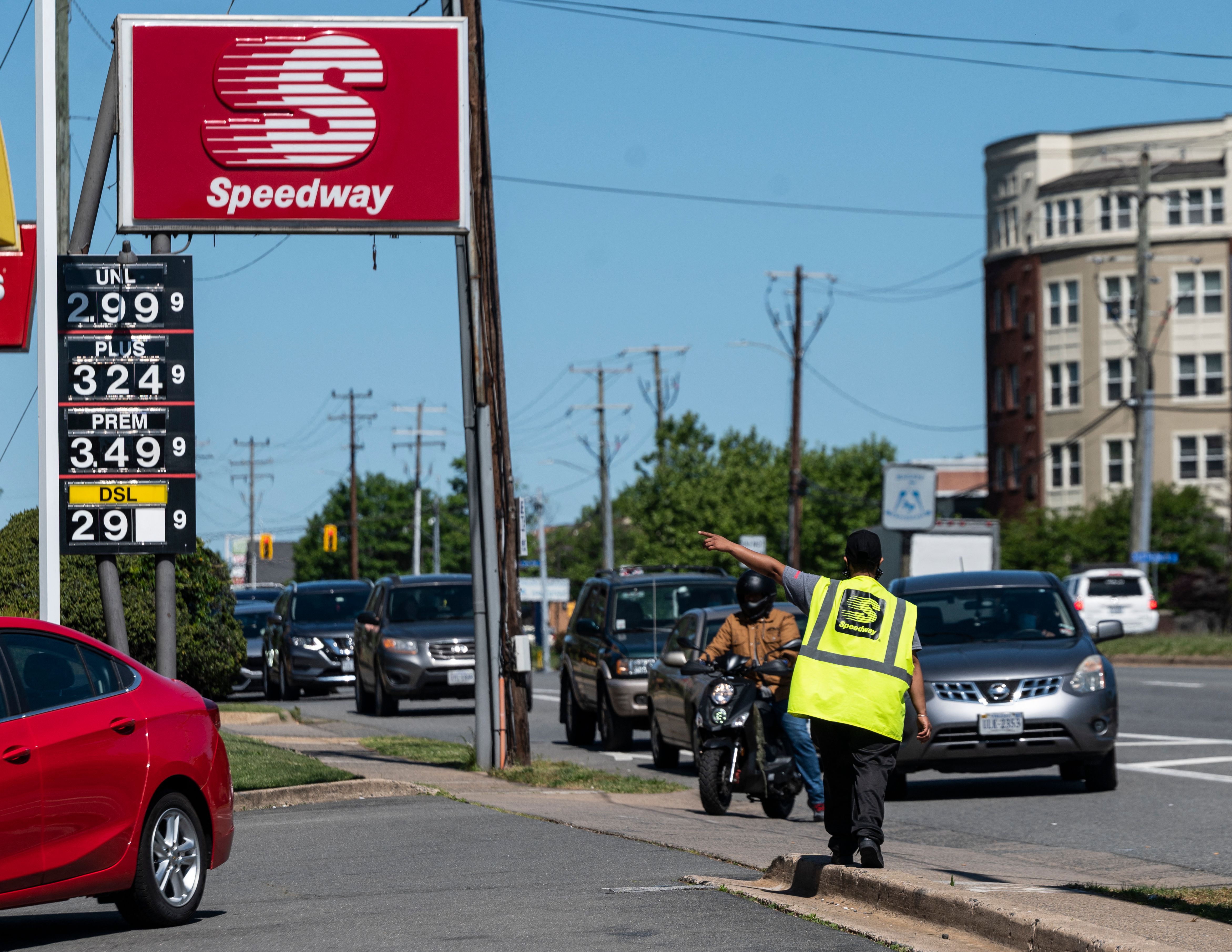 Motorists line up for fuel at one of the few remaining gas stations that still has fuel in Arlington, Virgina, on May 13, 2021.