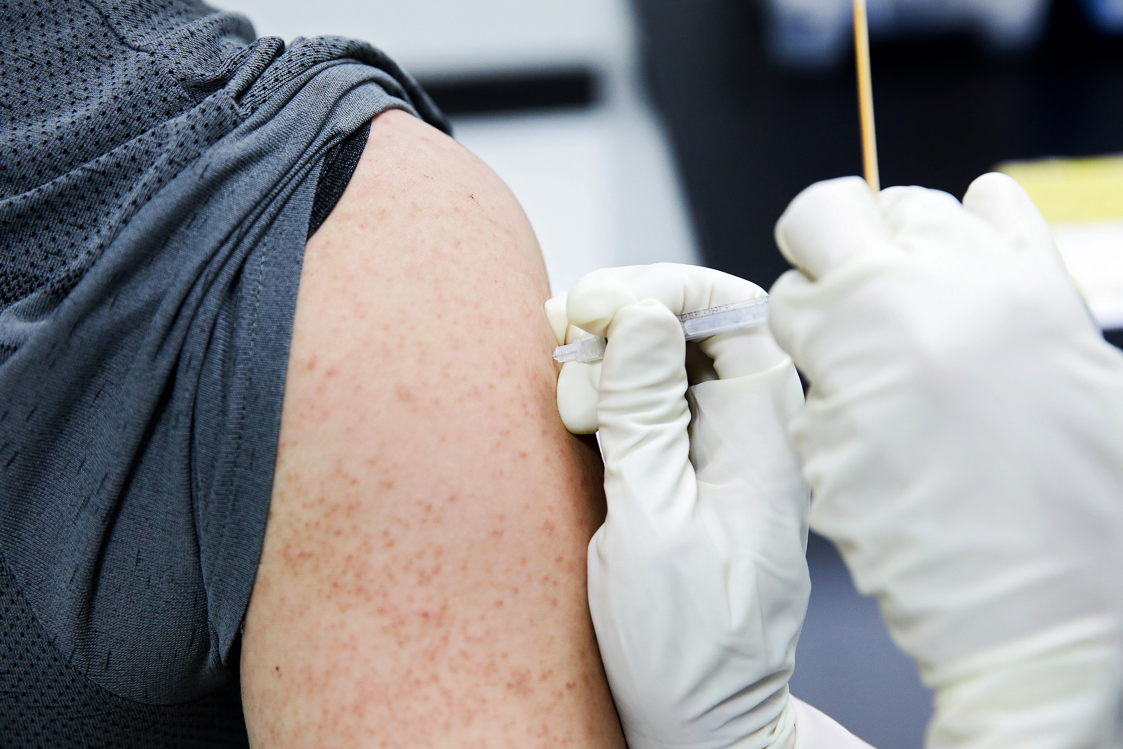 A nurse administers a dose of the AstraZeneca Plc Covid-19 vaccine at Chang Gung Memorial Hospital in Taipei, Taiwan, on Thursday, May 13, 2021. A rising number of Covid-19 infections is prompting thousands of members of the hesitant Taiwanese public to get vaccinated.