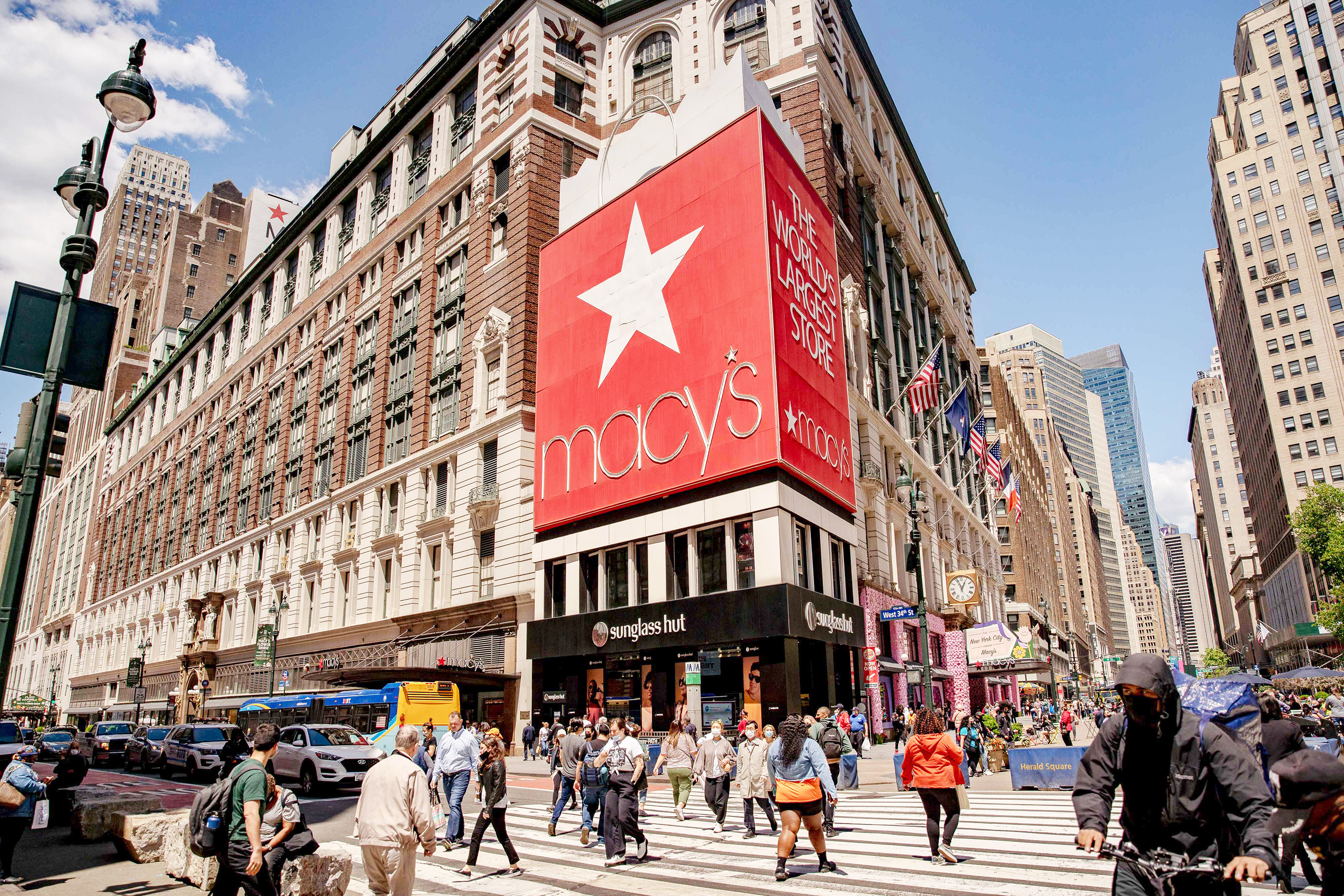Pedestrians pass in front of Macy’s flagship department store in the Herald Square area of New York City on Thursday, May 13, 2021. Macy’s Inc. is scheduled to release earnings figures on May 18. 