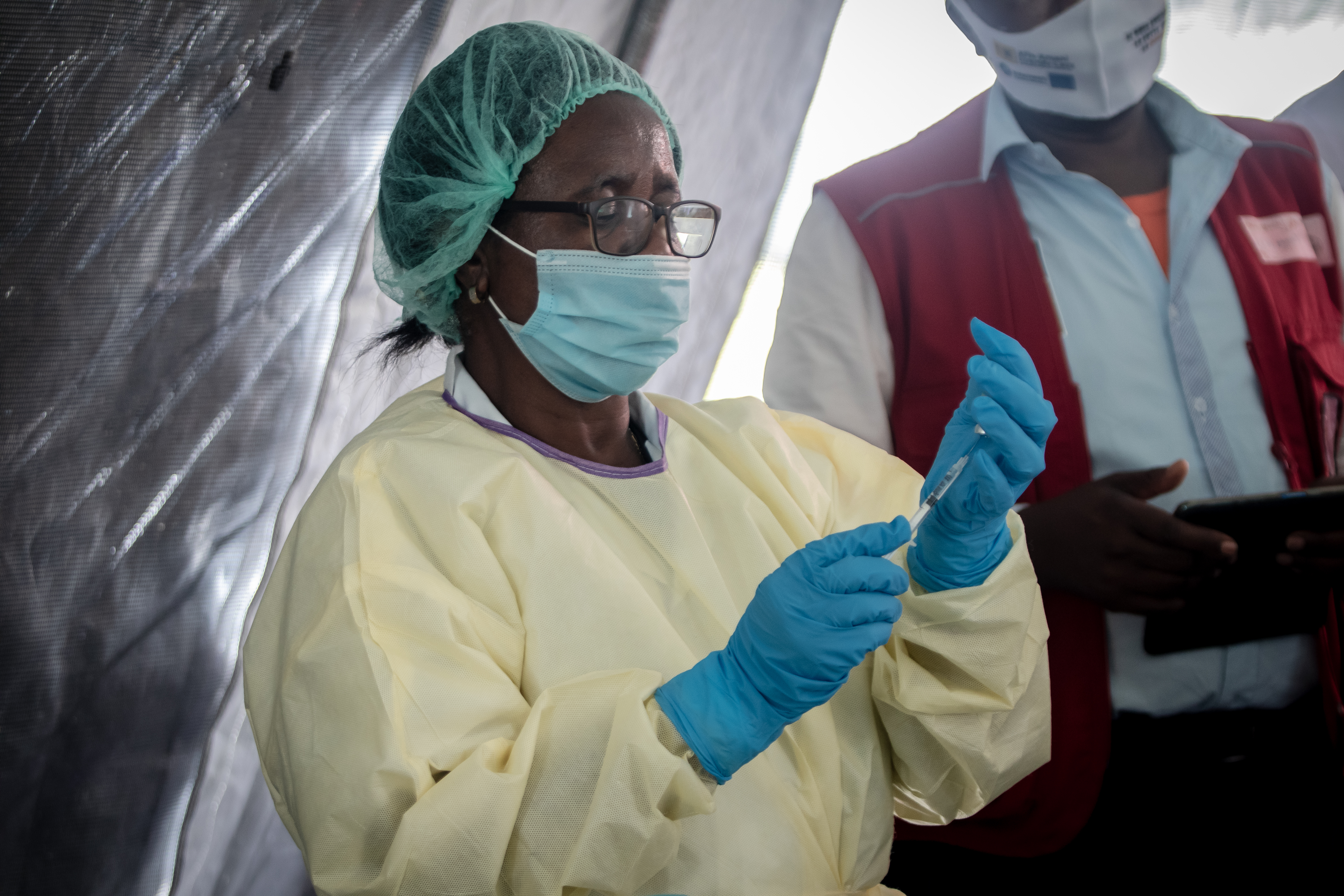 A medical assistant prepares a syringe of the  AstraZeneca COVID-19 vaccine in Goma, Democratic Republic of Congo. 