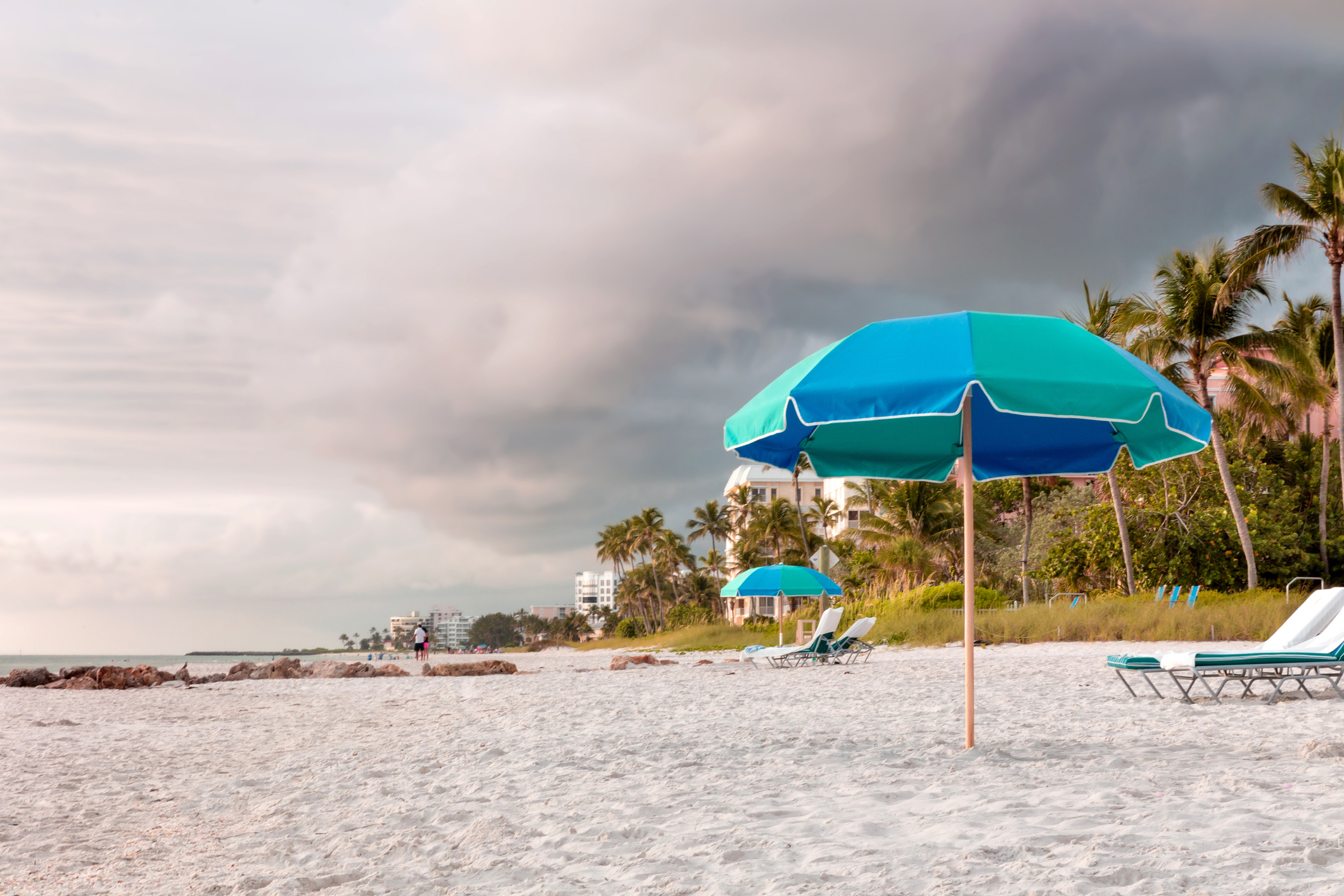 Umbrellas at a beach before a tropical storm, Naples, Fla.