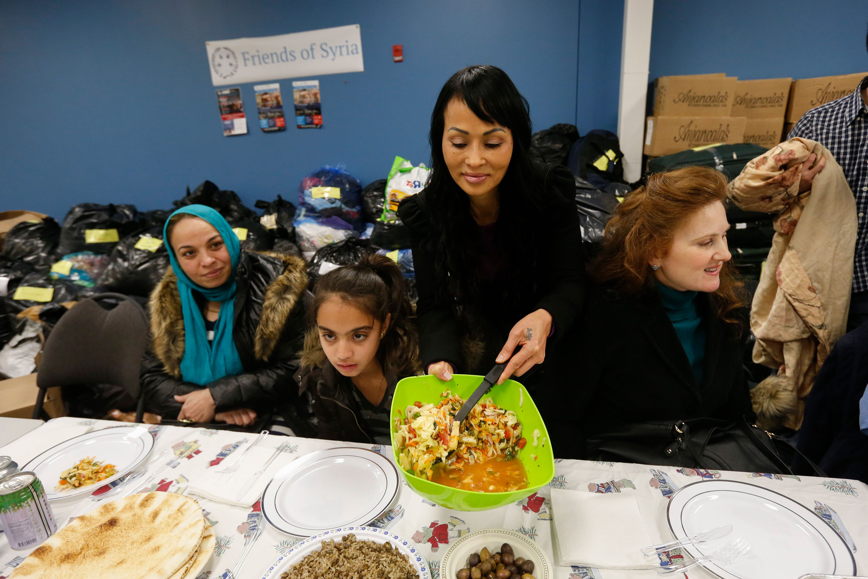 A support group hosts a dinner for Syrian refugees in Toronto, on Dec. 27, 2015.