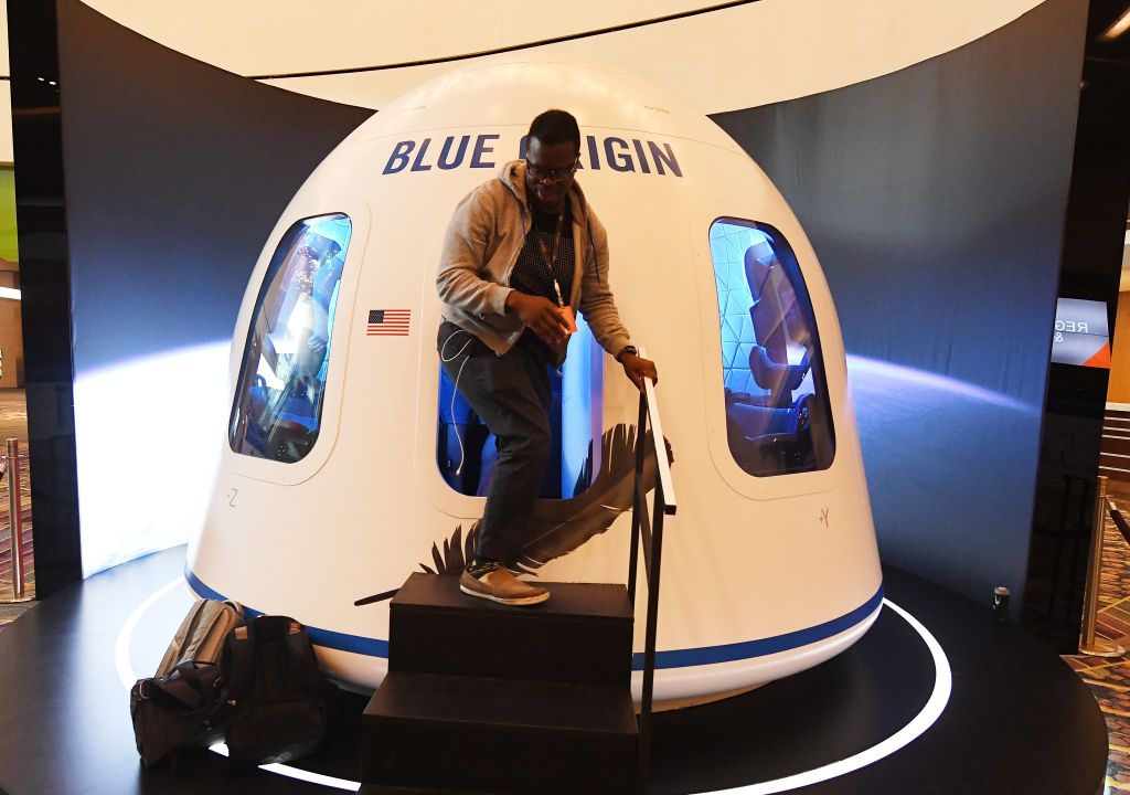 Participants leave the Blue Origin space simulator during the Amazon Re:MARS conference on robotics and artificial intelligence at the Aria Hotel in Las Vegas on June 5, 2019.