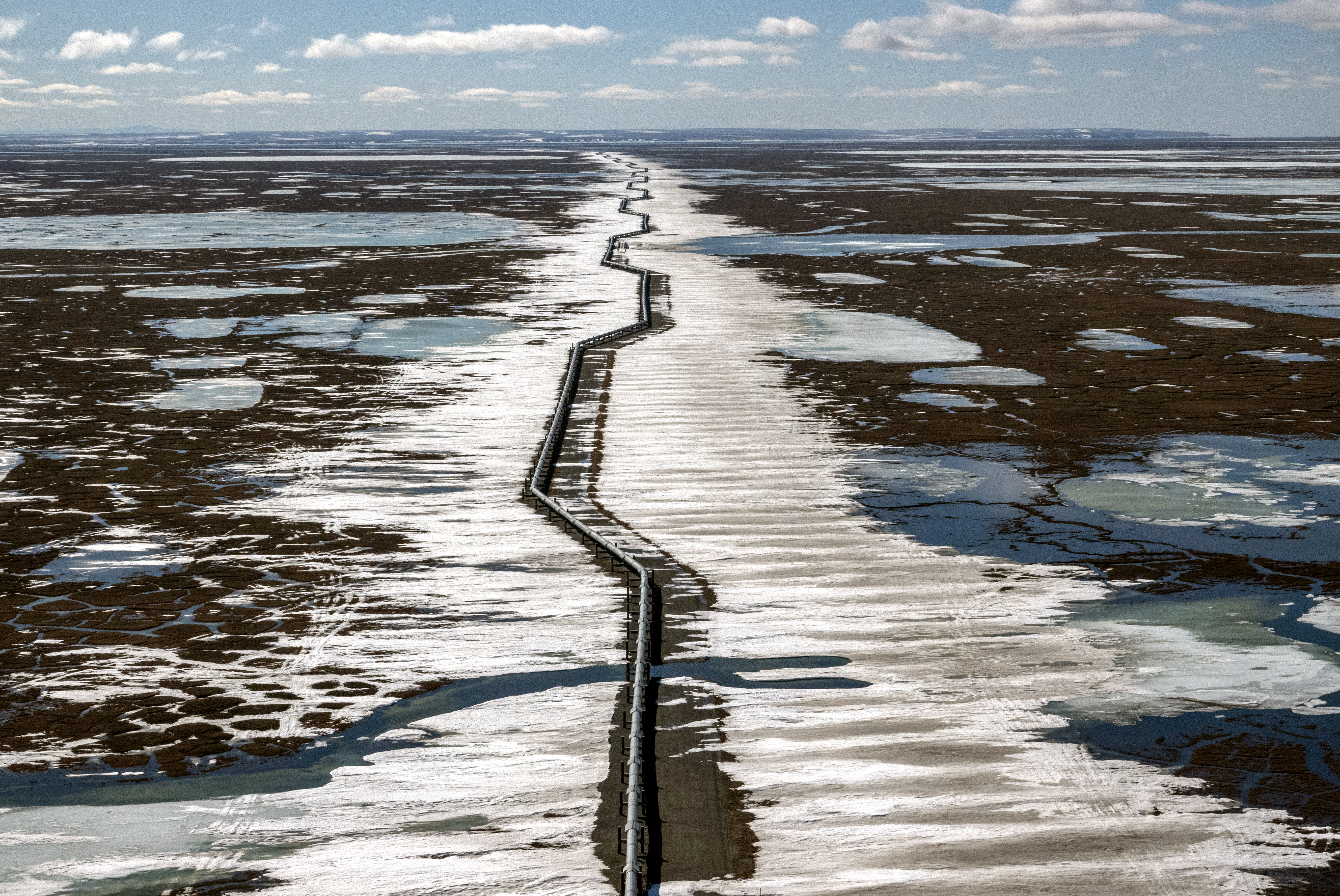 An oil pipeline stretches across the landscape outside Prudhoe Bay in North Slope Borough, AK on May 25, 2019.