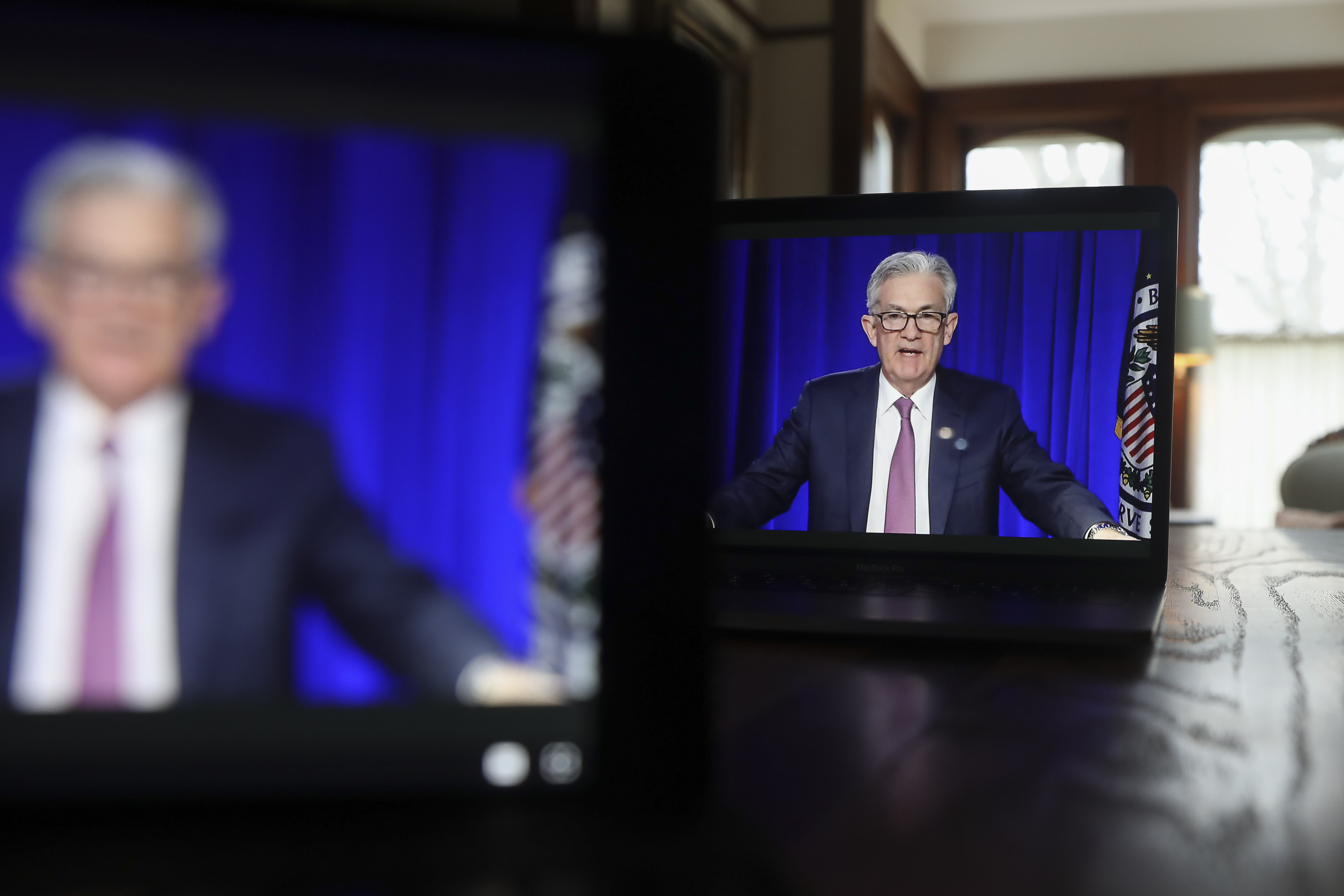 Jerome Powell, chairman of the U.S. Federal Reserve, speaks during a virtual news conference. On Wednesday, the Fed surprised the markets by signaling two rate hikes by end of 2023, triggering a sell-off in stocks.