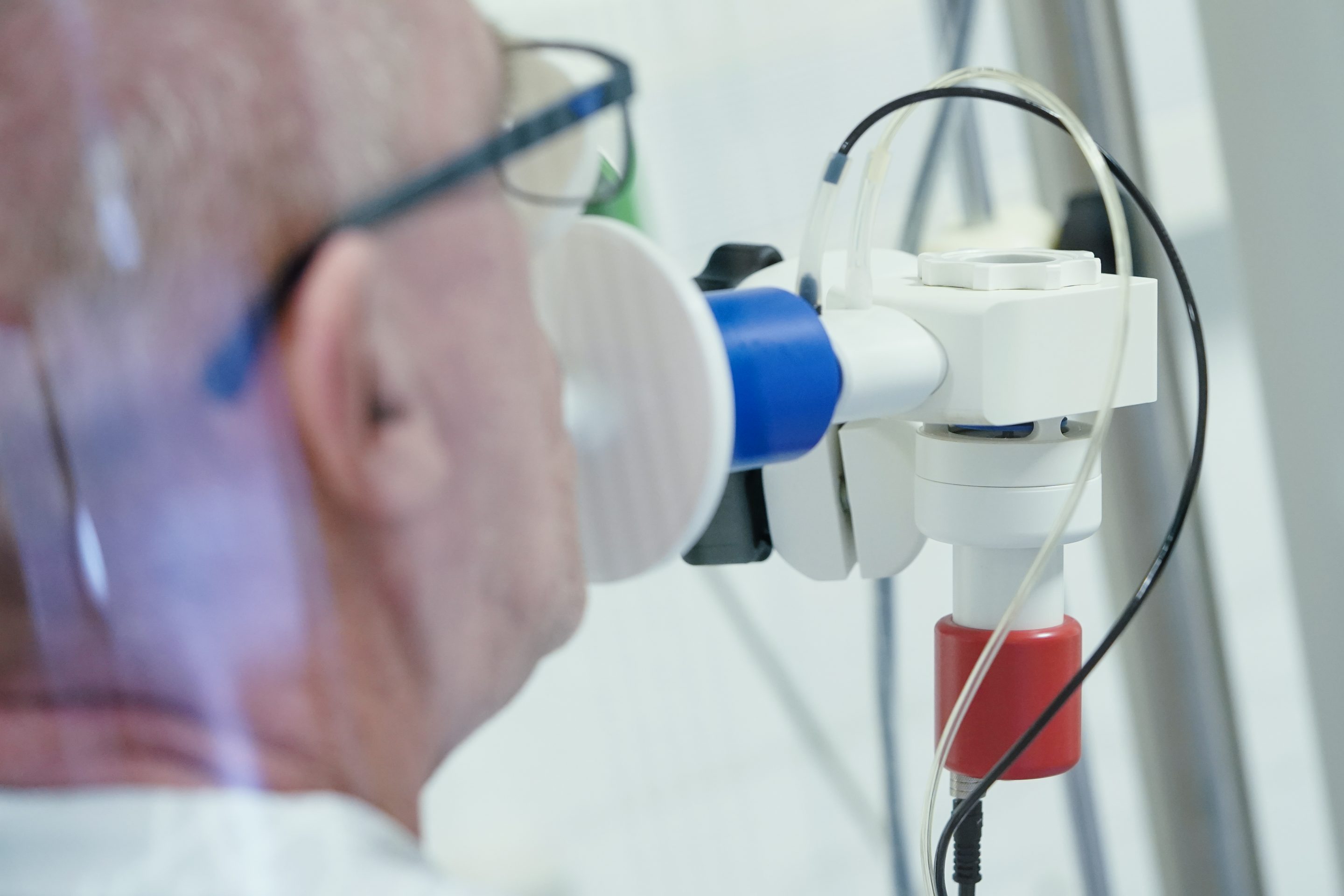 A patient that has recovered from COVID-19 has his lung function measured in a lung test cabin in the Heidelberg-Königstuhl rehabilitation clinic in Baden-Wuerttemberg, Germany.