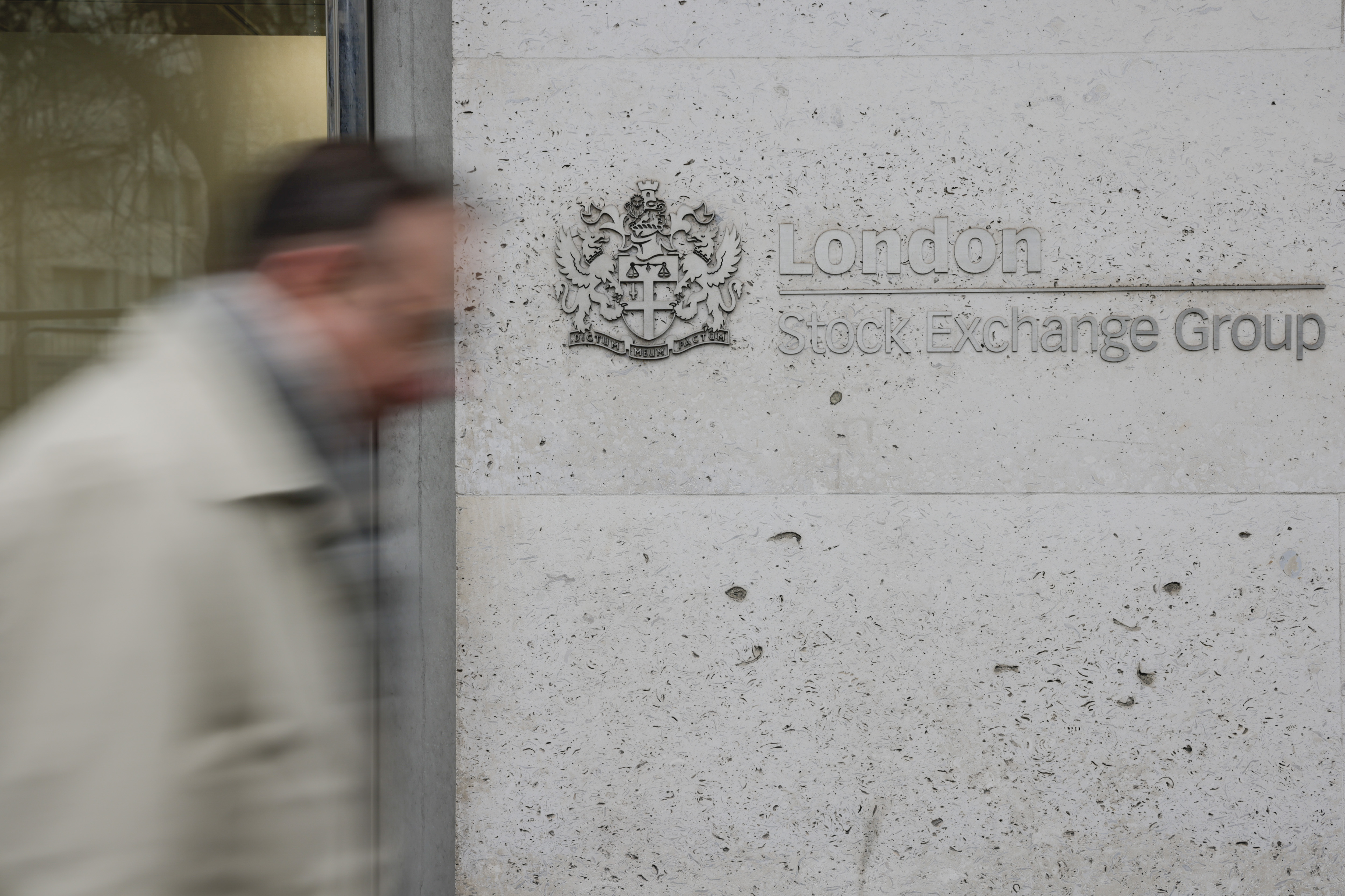 A pedestrian passes the London Stock Exchange in the square mile financial district of the City of London, U.K., on Monday, Jan. 4, 2021. Britain's long-awaited trade deal with the European Union still leaves many questions unanswered for the world's biggest banks, trading venues and money managers as they prepare for a rupture in the region's financial system.
