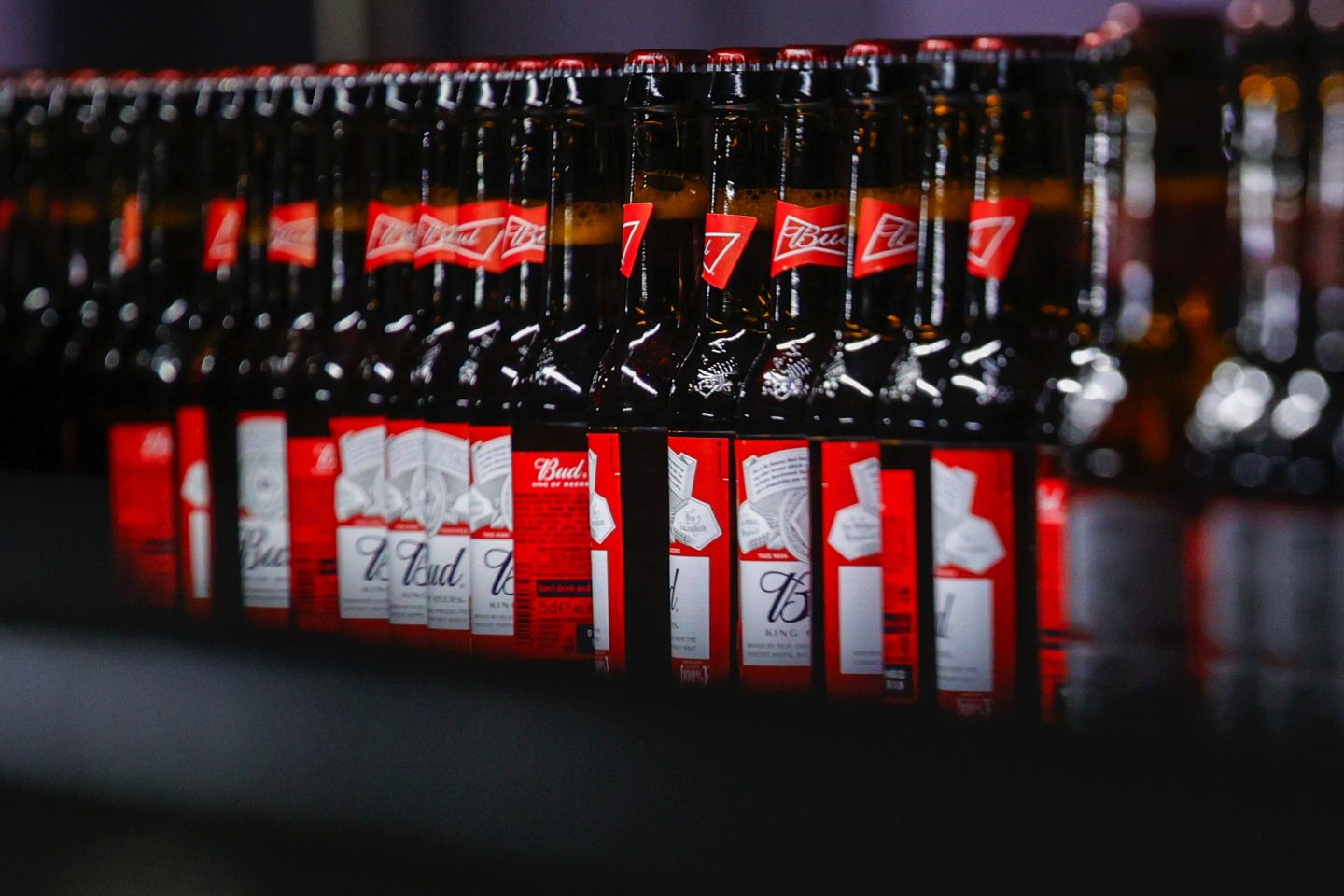 Bottles of Budweiser beer on a conveyor at the Anheuser-Busch InBev NV brewery in Leuven, Belgium