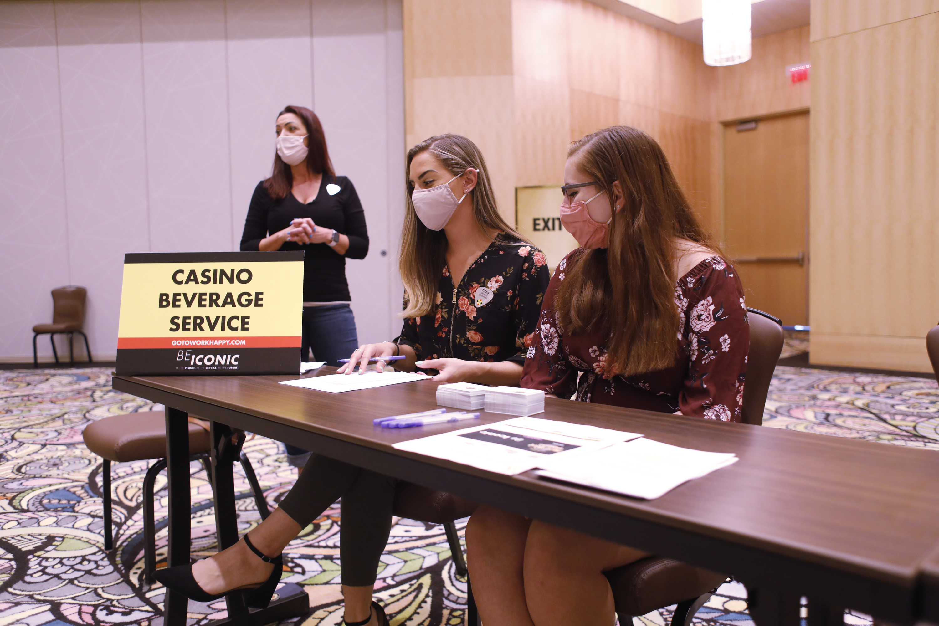 Seminole Hard Rock Casino department supervisors Tiffany Simmermeyer (L) and Taloiah Sotomayor wait to speak with job applicants during a job fair at the Seminole Hard Rock Casino on May 25, 2021 in Tampa, Florida. Economists forecast that a net 674,000 new jobs were created last month.