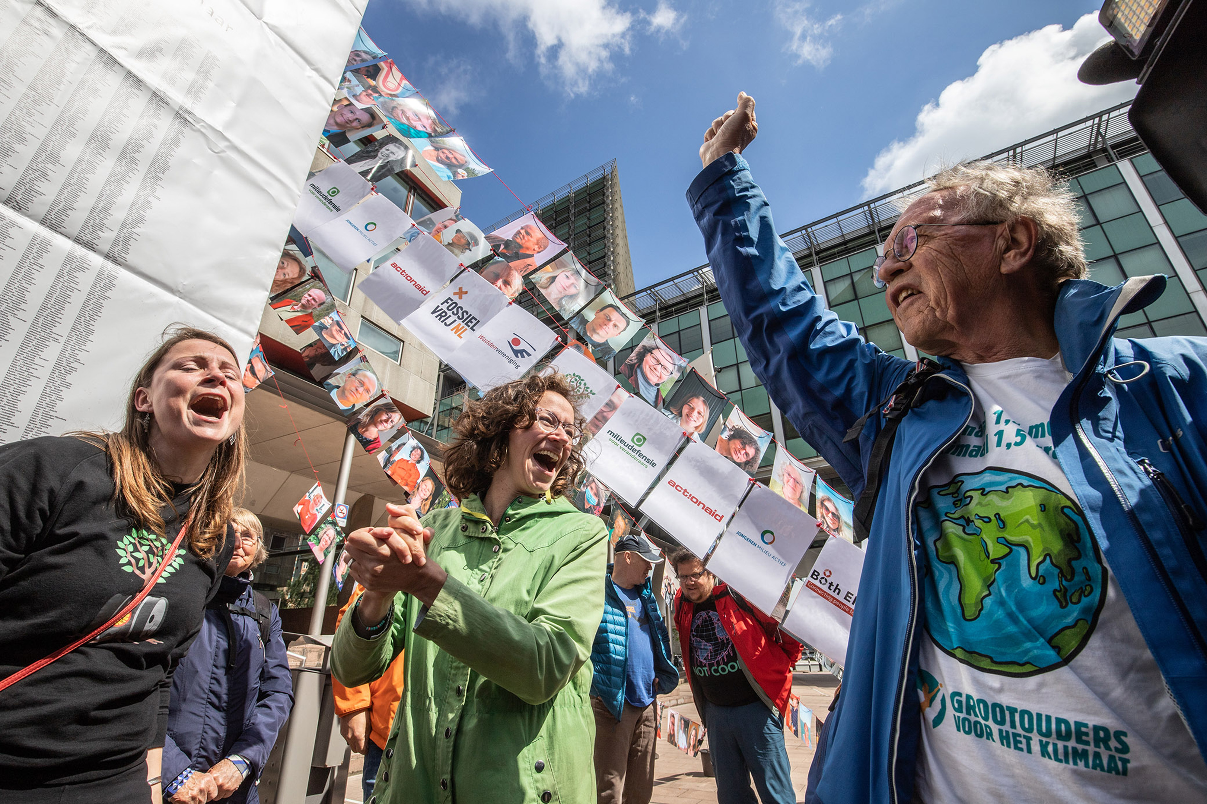 Members of the environmental group MilieuDefensie celebrate the verdict of the Dutch environmental organisation's case against Royal Dutch Shell Plc, outside the Palace of Justice courthouse in The Hague, Netherlands, on Wednesday, May 26, 2021.