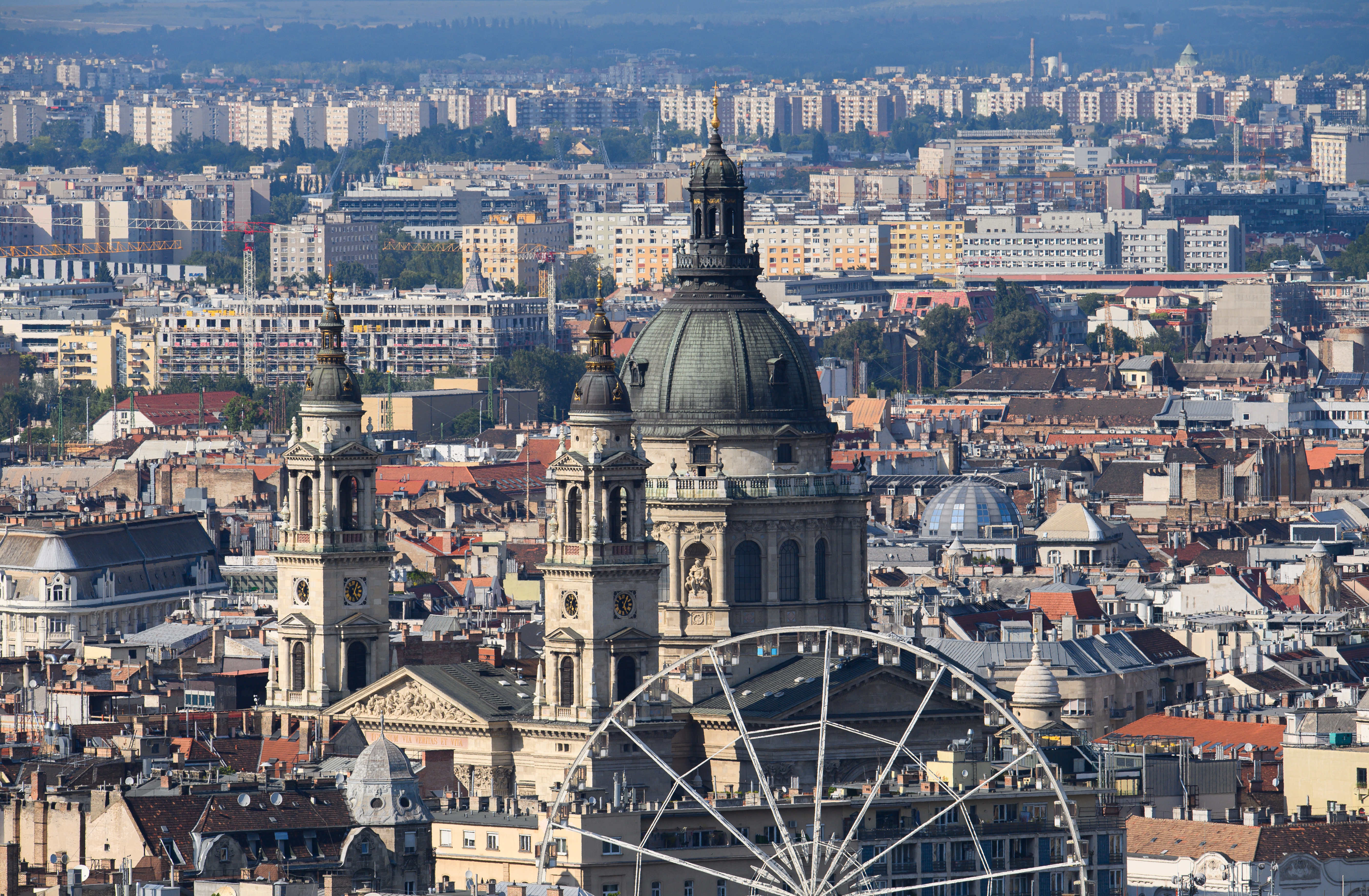 Afternoon view of St. Stephen's Basilica and the "Budapest Eye Ferris Wheel" in the Pest district. 
