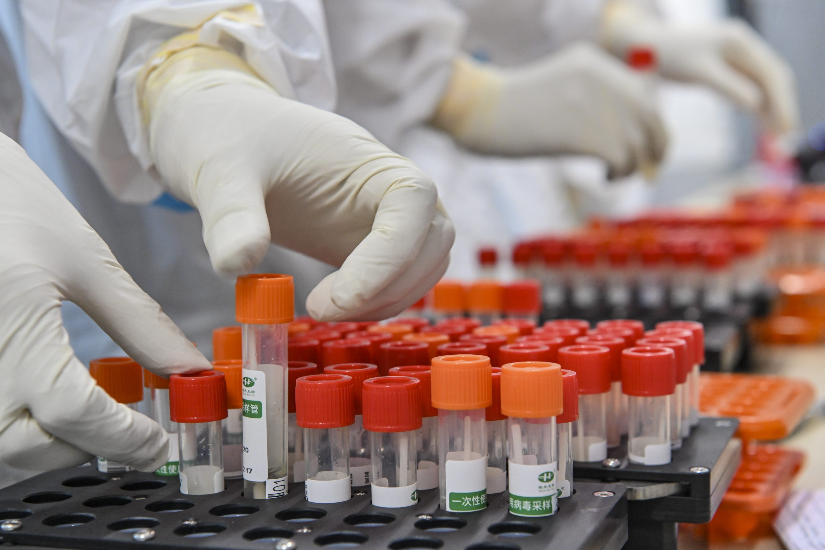 Medical staff check nucleic acid test samples in an air-inflated mobile COVID-19 test lab, known as the "Falcon labs", in Guangzhou Gymnasium on June 3, 2021 in Guangzhou, Guangdong Province of China.
