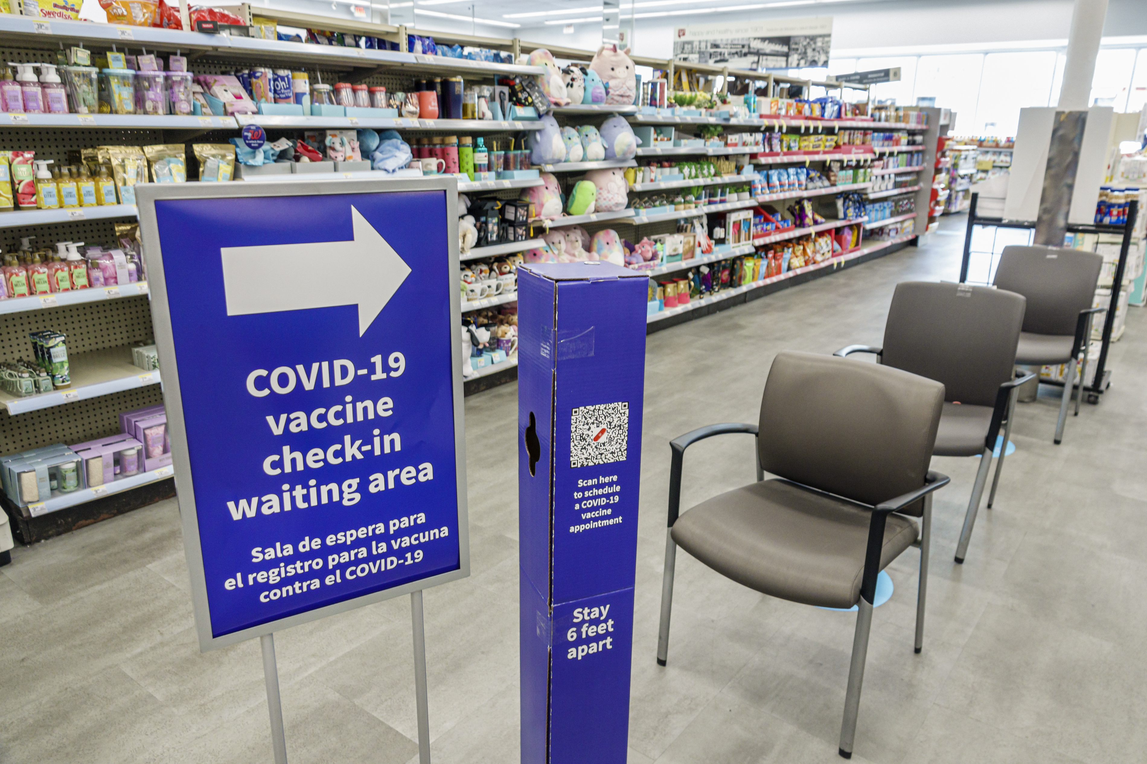 A COVID-19 vaccine check-in waiting area at a Walgreens in Miami Beach, Fla.