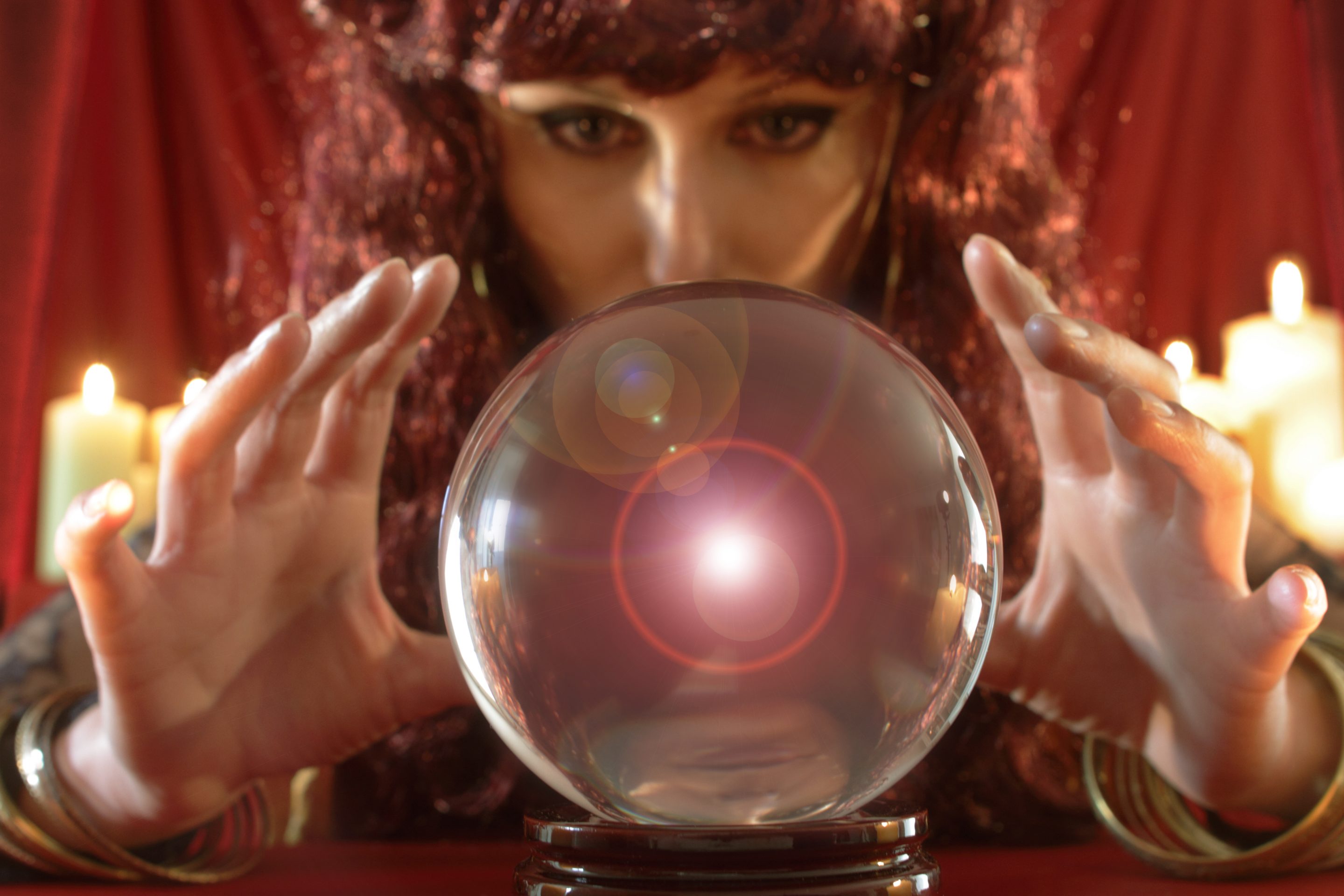 Image of a fortune teller staring into a crystal ball.