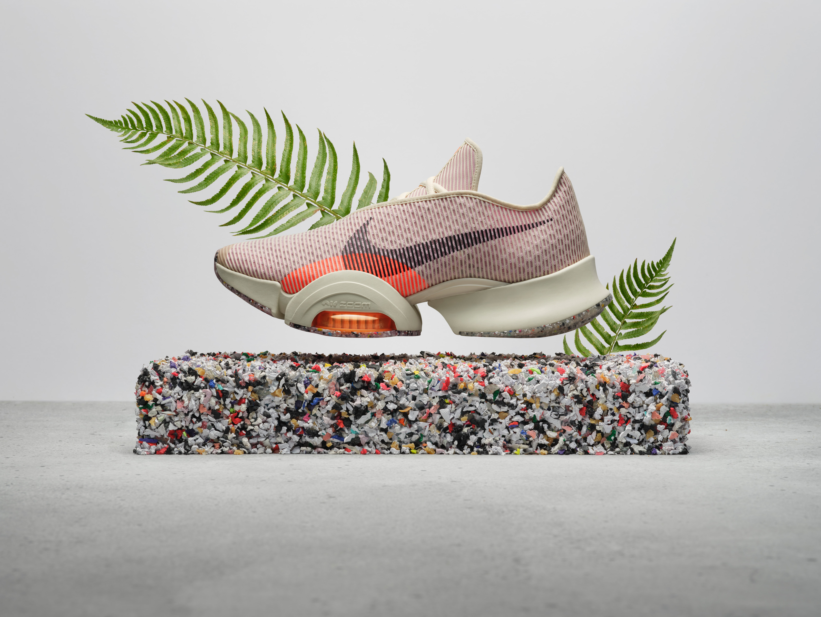 The Nike Air Zoom SuperRep 2 Next Nature shoes for circuit training were made with at least 20% recycled materials by weight, implementing Nike Grind in the outsole and old manufacturing scraps, recycled polyester, and plastic bottles throughout the upper and midsole.