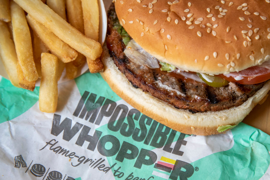In this photo illustration, the new Impossible Whopper sits on a table on August 8, 2019 in the Brooklyn borough of New York City.  A single Impossible Whopper sandwich costs $5.99.
