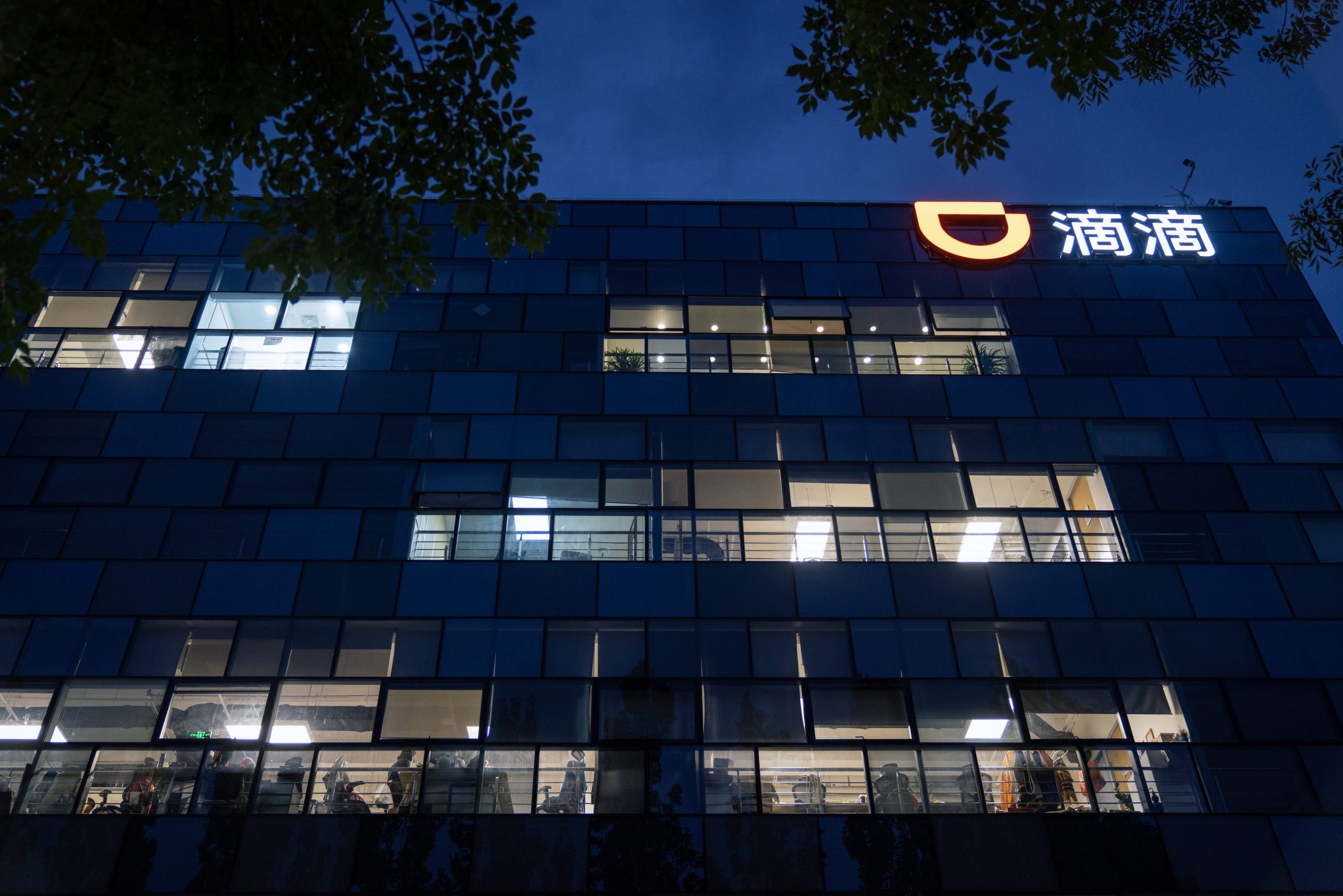Illuminated office windows at the Didi Global Inc. headquarters at night in Beijing, China, on July 5, 2021.
