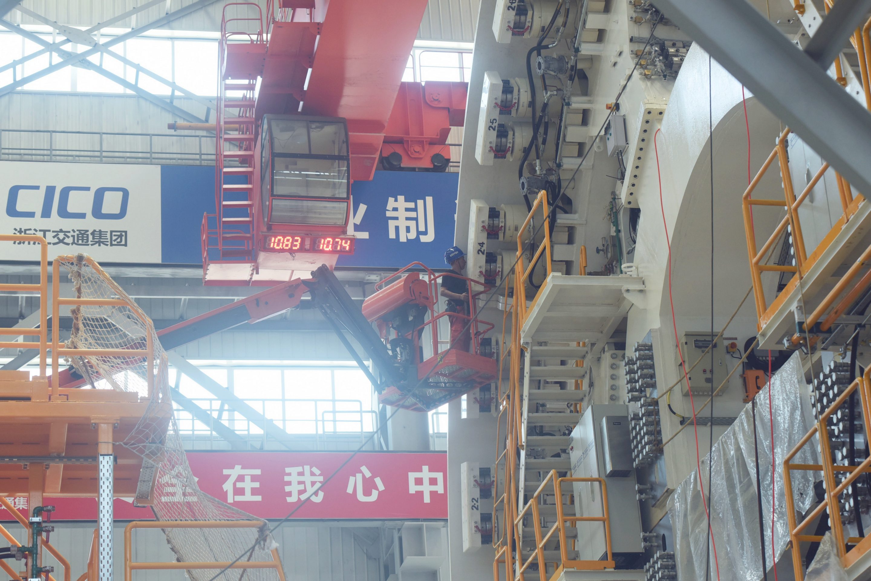Staff of China Railway Engineering assemble the shield tunneling machine for Shenzhen Metro Line 16 at the plant of China Railway Engineering in Xiaoshan District, Hangzhou, Zhejiang on July 15, 2021.