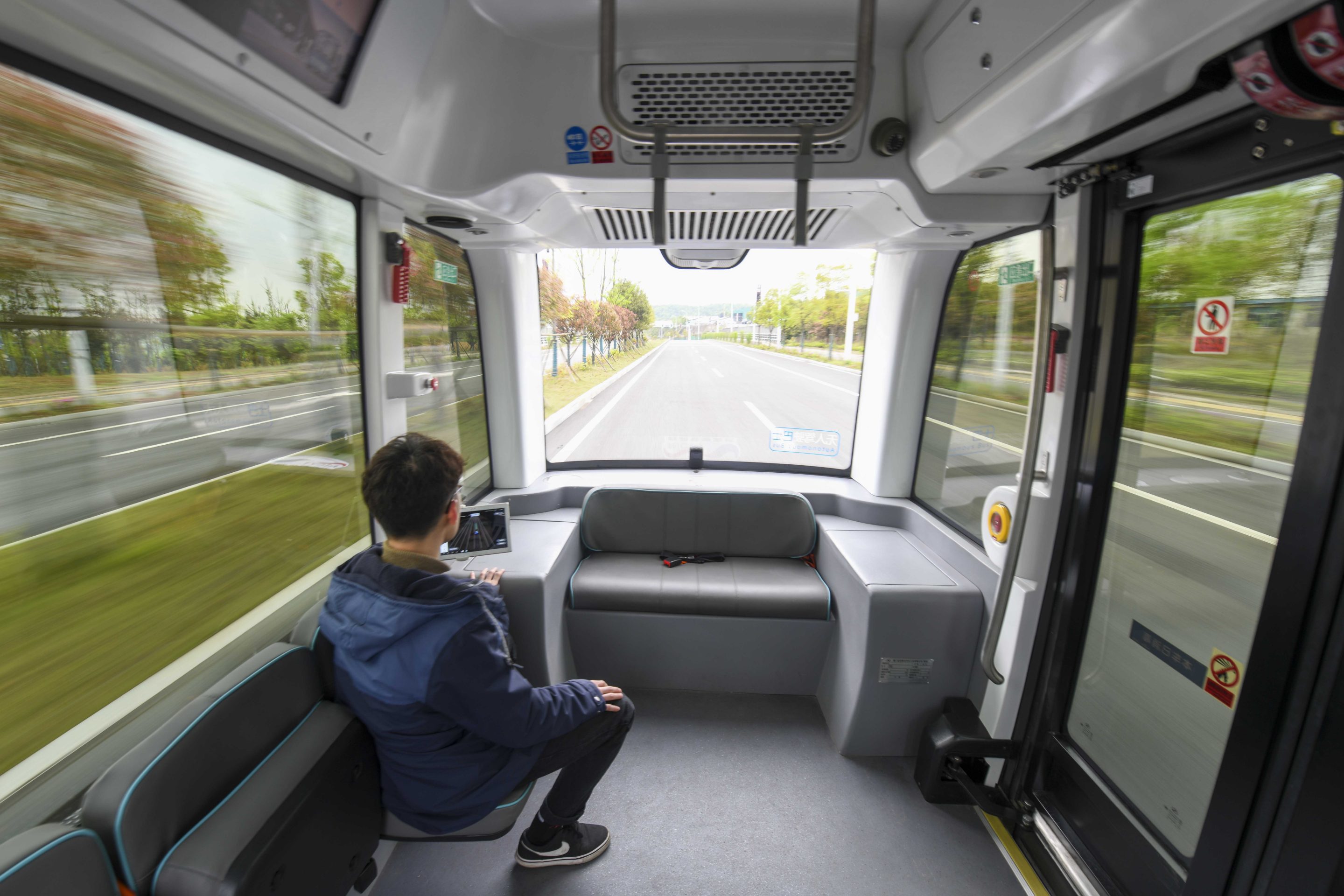 An autonomous driving bus operated by Baidu’s Apollo system runs at a testing facility in Changsha, China. Baidu is one of several tech giants collaborating with China’s government on advances in A.I.