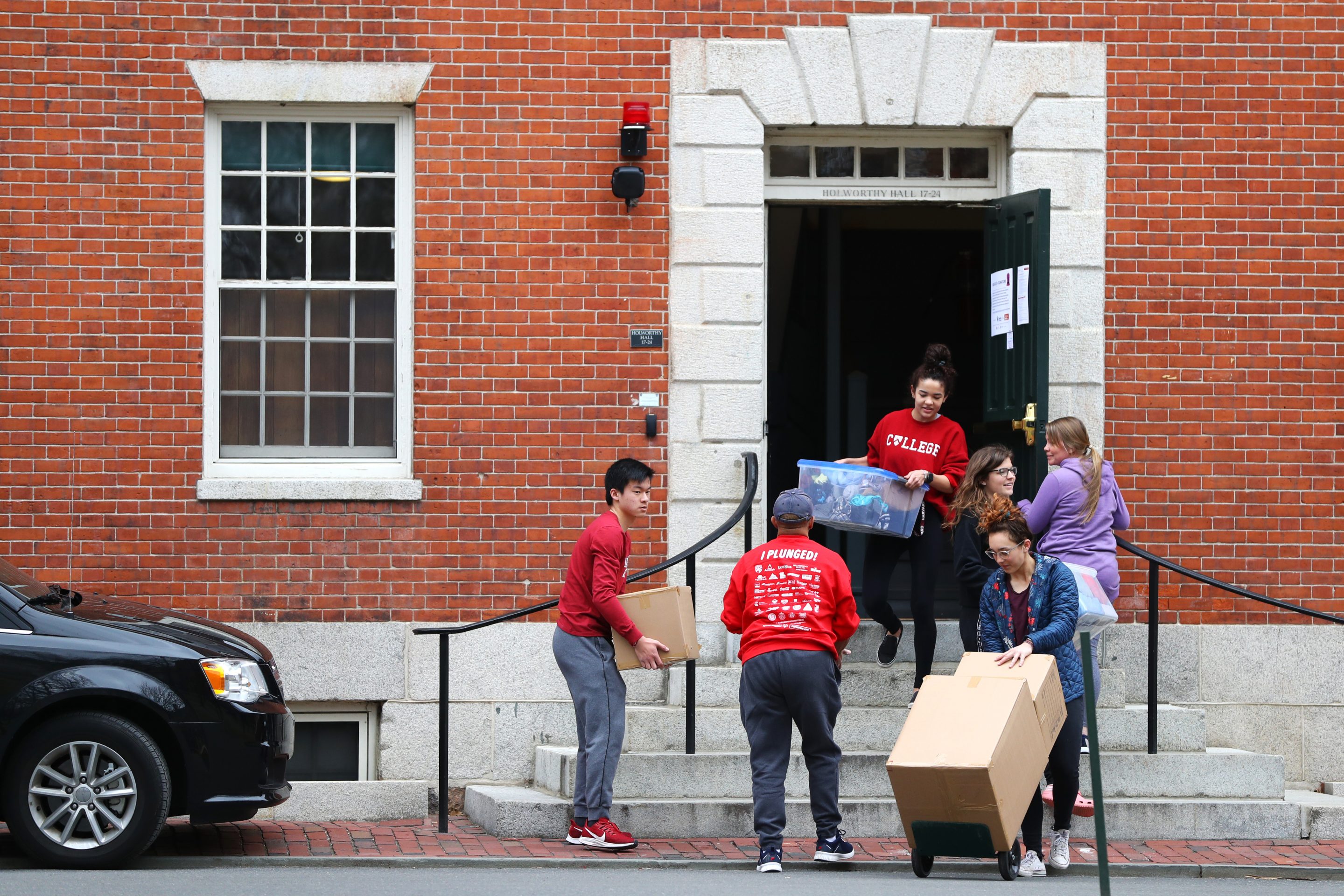Students move out of dorm rooms on Harvard Yard on the campus of Harvard University on March 12, 2020, in Cambridge, Mass.