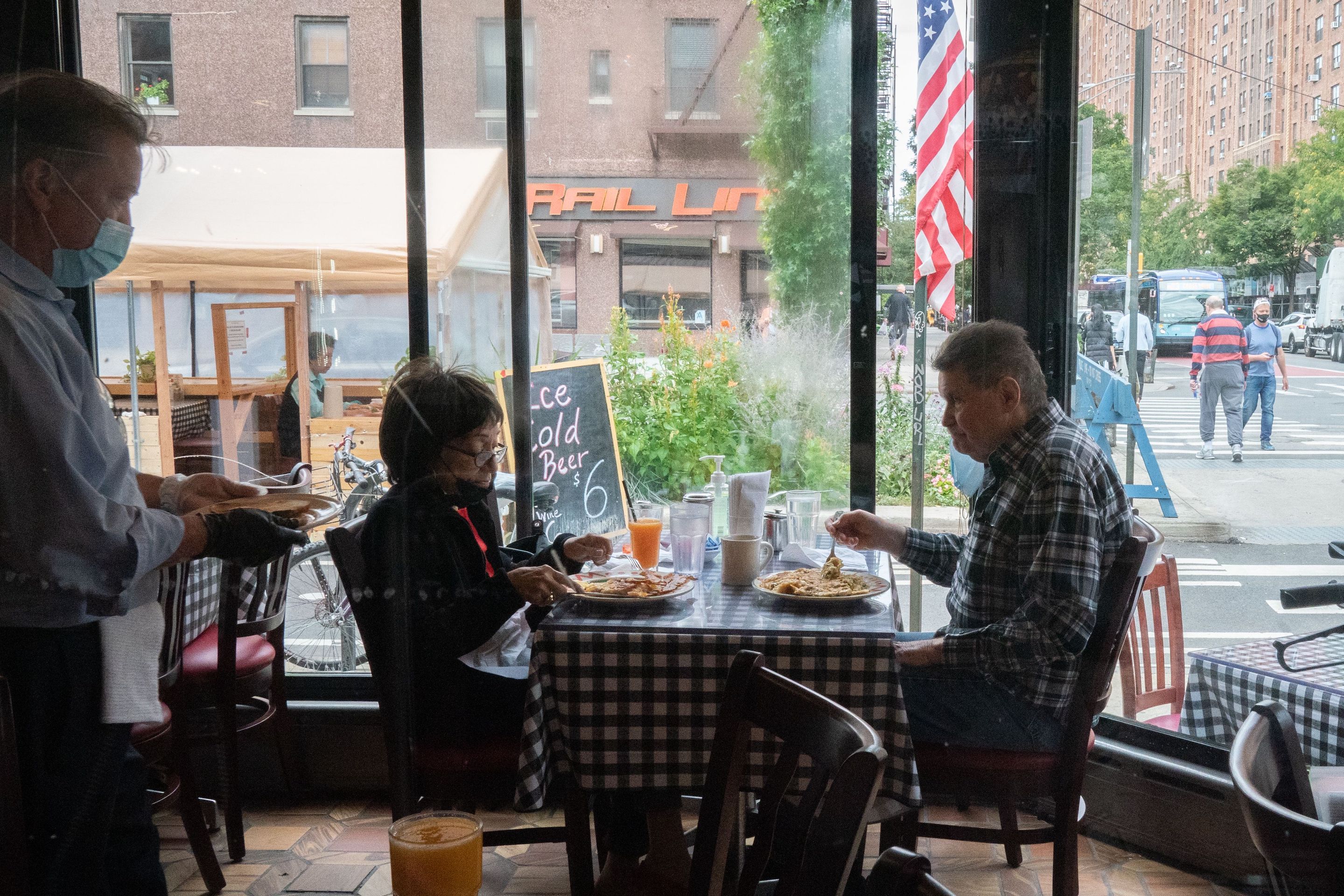 People have lunch at Chelsea Square Restaurant in New York.