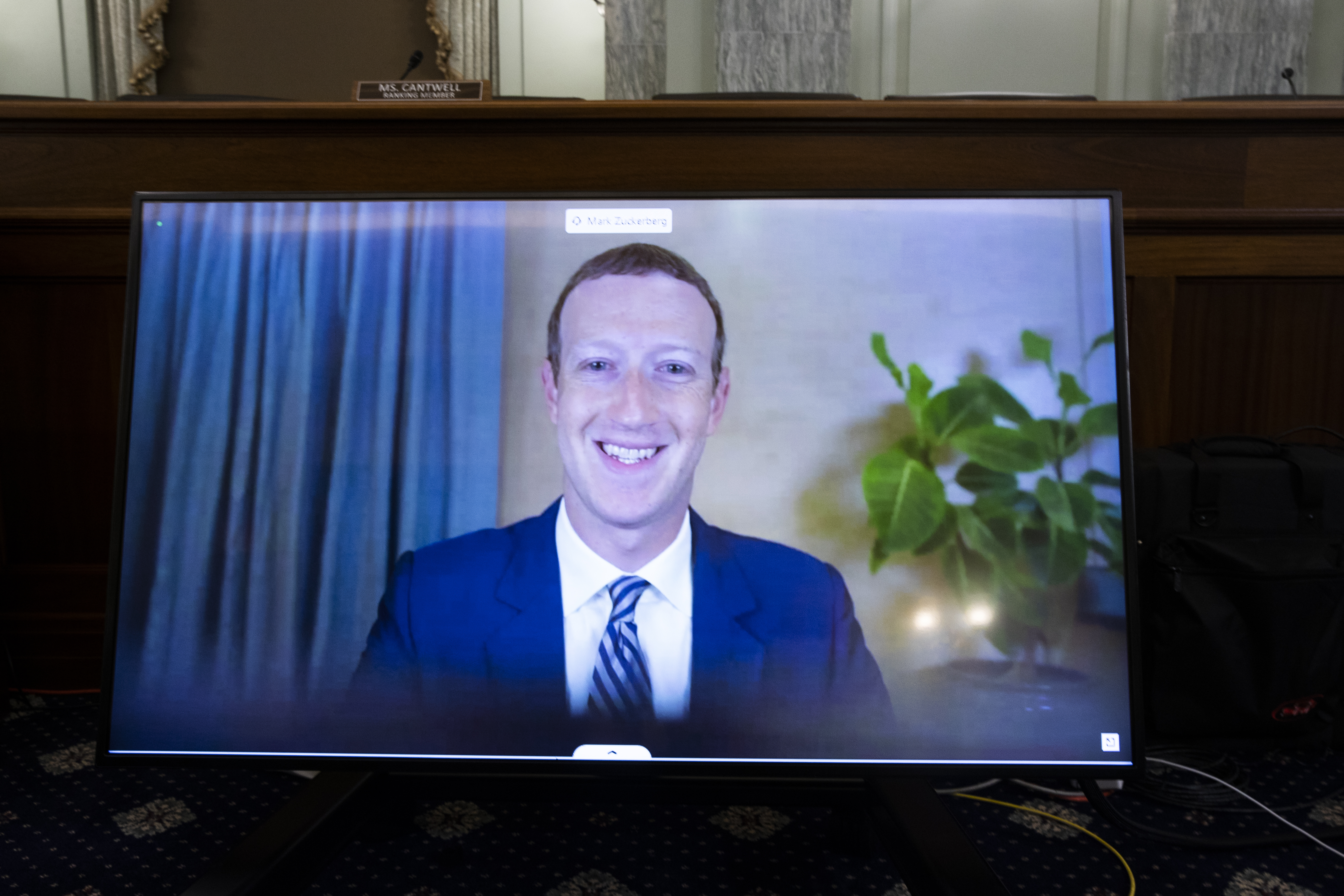 CEO of Facebook Mark Zuckerberg appears on a monitor as he testifies remotely during the Senate Commerce, Science, and Transportation Committee hearing 'Does Section 230's Sweeping Immunity Enable Big Tech Bad Behavior?', on Capitol Hill, October 28, 2020 in Washington, DC.