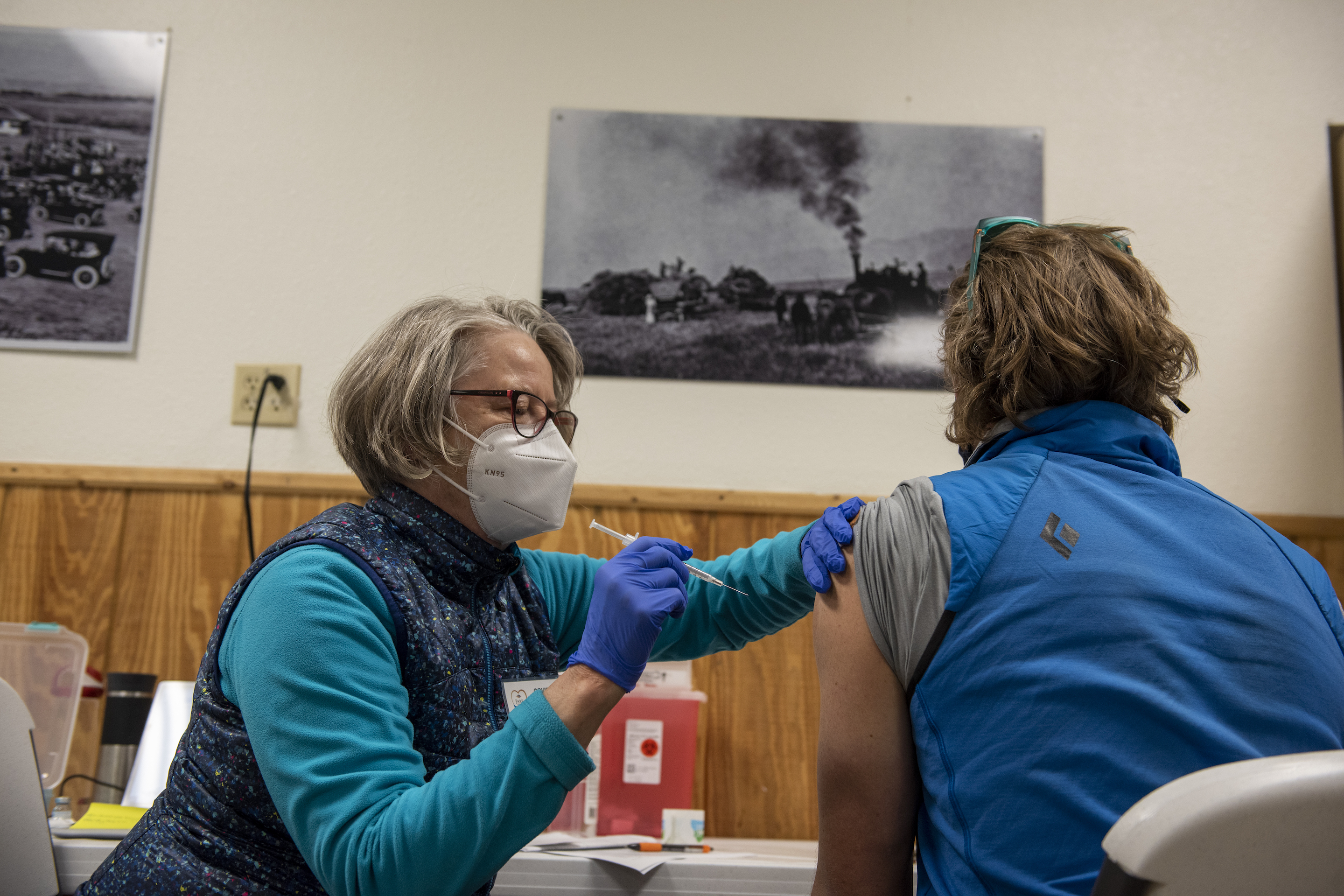 Nurse Mary Hesse administers a Moderna vaccination at the Park County Health Department vaccination center at the Rodeo-Fairgrounds on April 1, 2021 in Livingston, Montana.
