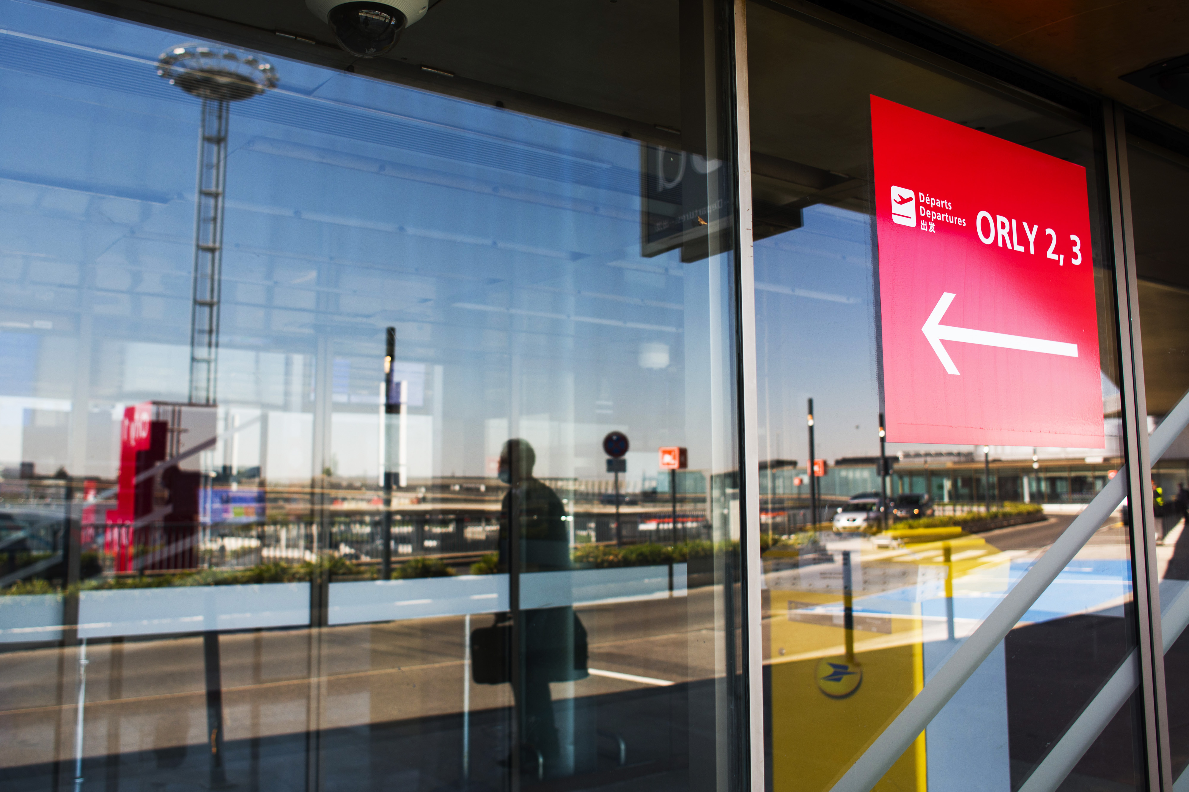 A direction sign for Terminals 2 and 3 at Orly Airport, operated by Aeroports de Paris.